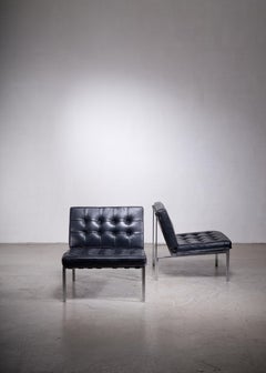 Pair of Kurt Thut side chairs with black leather tufted cushions