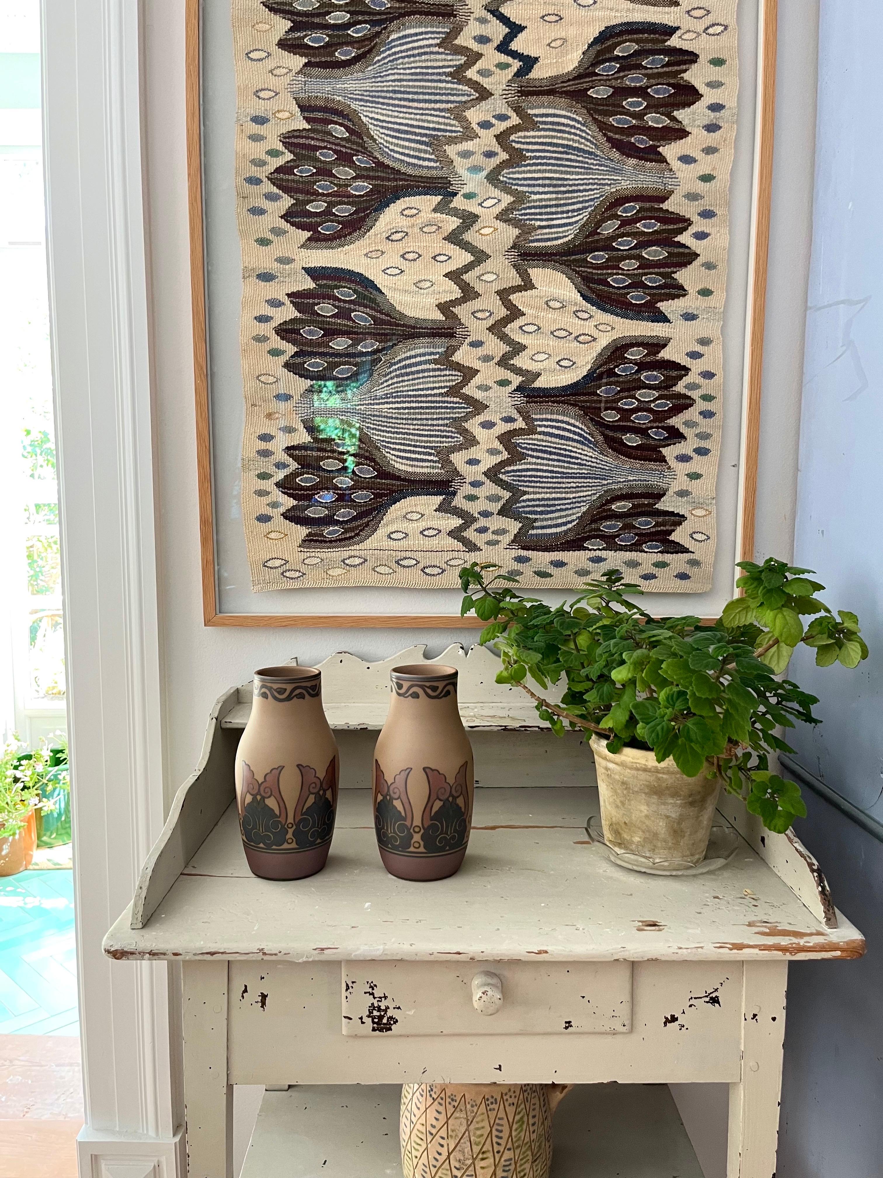 Pair of L. Hjorth Art Nouveau Ceramic Vases Hand Decorated, Denmark, 1930s

A pair of Danish Art Nouveau ceramic vases from the 1930s, handmade by L. Hjorth's ceramic workshop on the Danish island of Bornholm, renowned for its exceptional ceramics.
