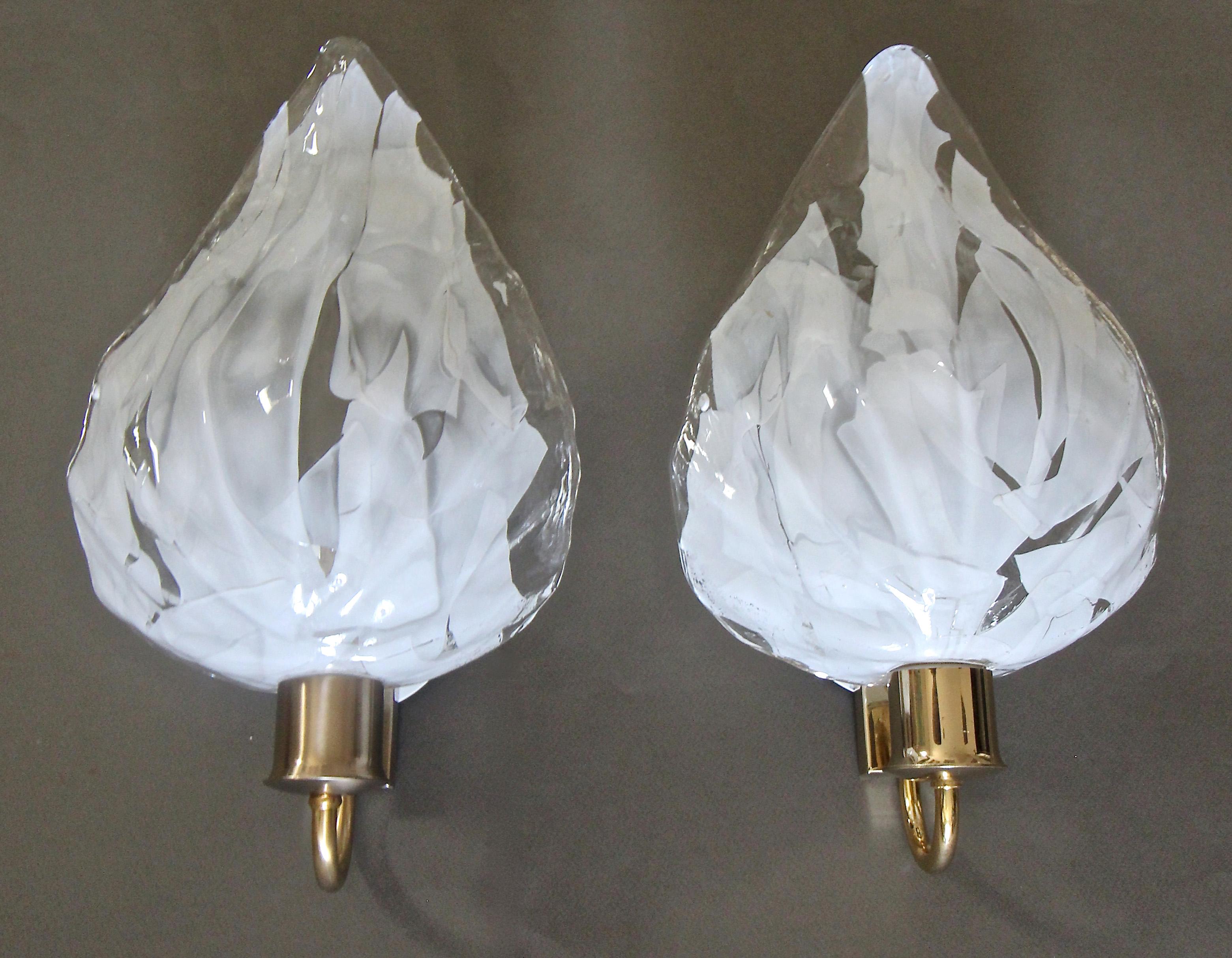 Pair of La Murrina Italian handblown clear and white leaf shaped wall sconces mounted on brass wall plates. Newly wired for the US. Each uses a single A or Edison base bulb. (White junction box cover included, see photo.) 

Measures: Glass alone