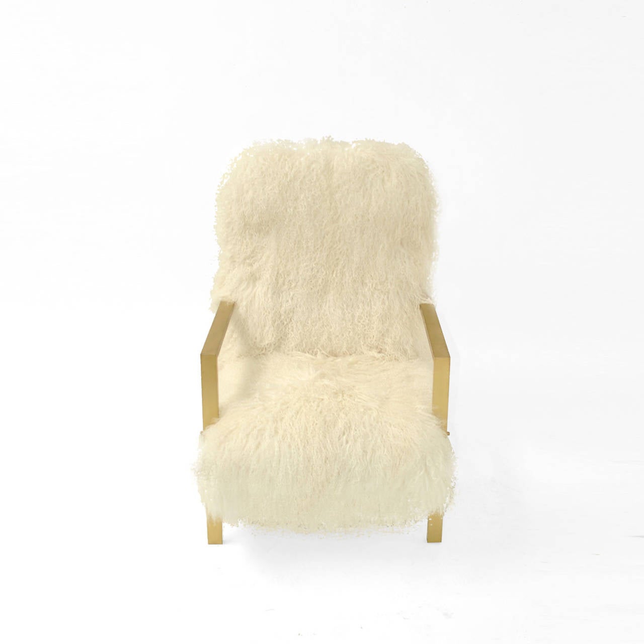 Comfortable armchairs designed by the creative team L.A. Studio and manufactured in Italy. Upholstered in natural white Mongolian goat´s fur.
Base made of solid wood, arms and legs are made of rectangular solid brass tube that continuous as a