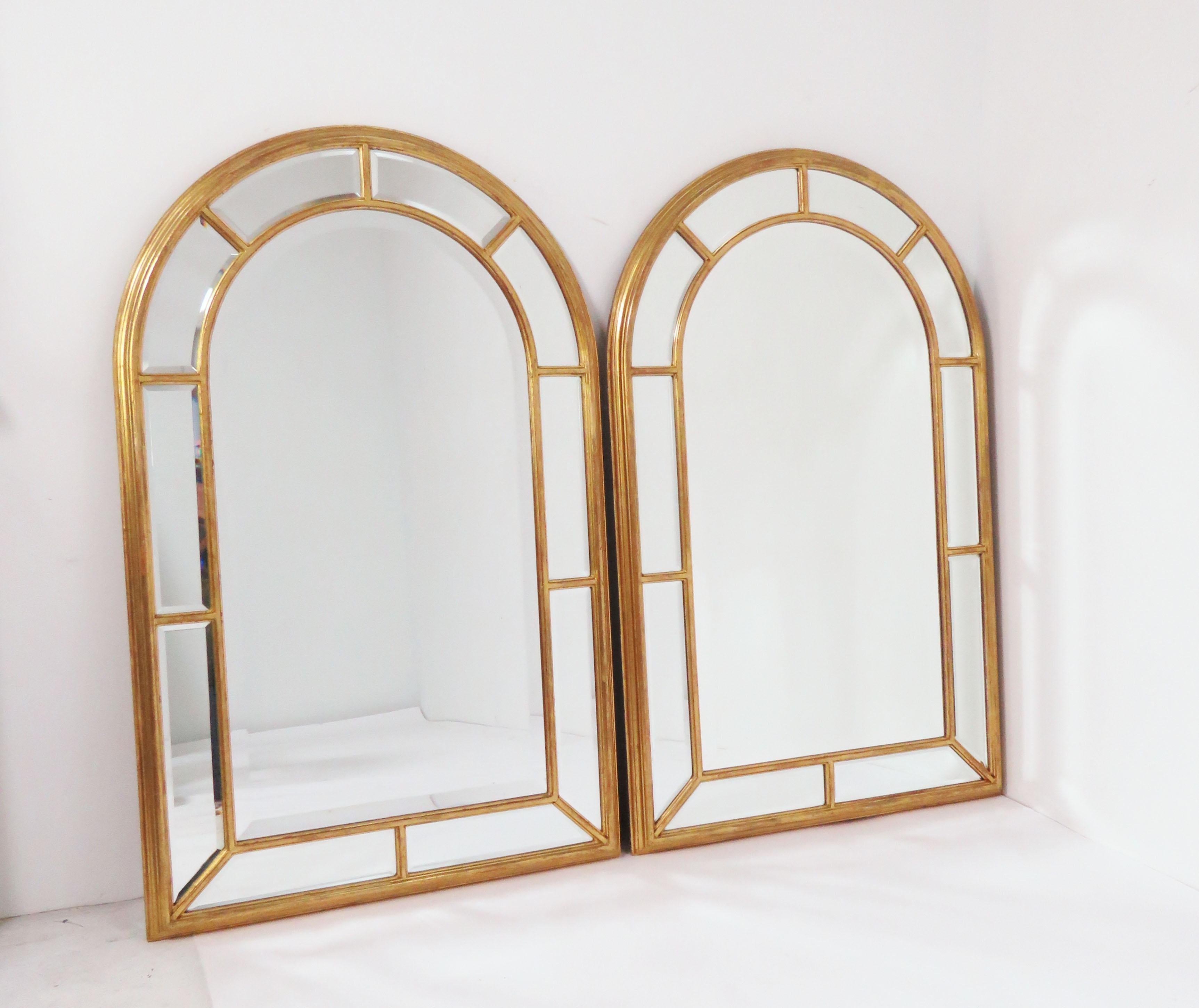 Pair of giltwood wall mirrors, circa 1970s, made in Florence, Italy for LaBarge. Palladian form with individually beveled panes.
