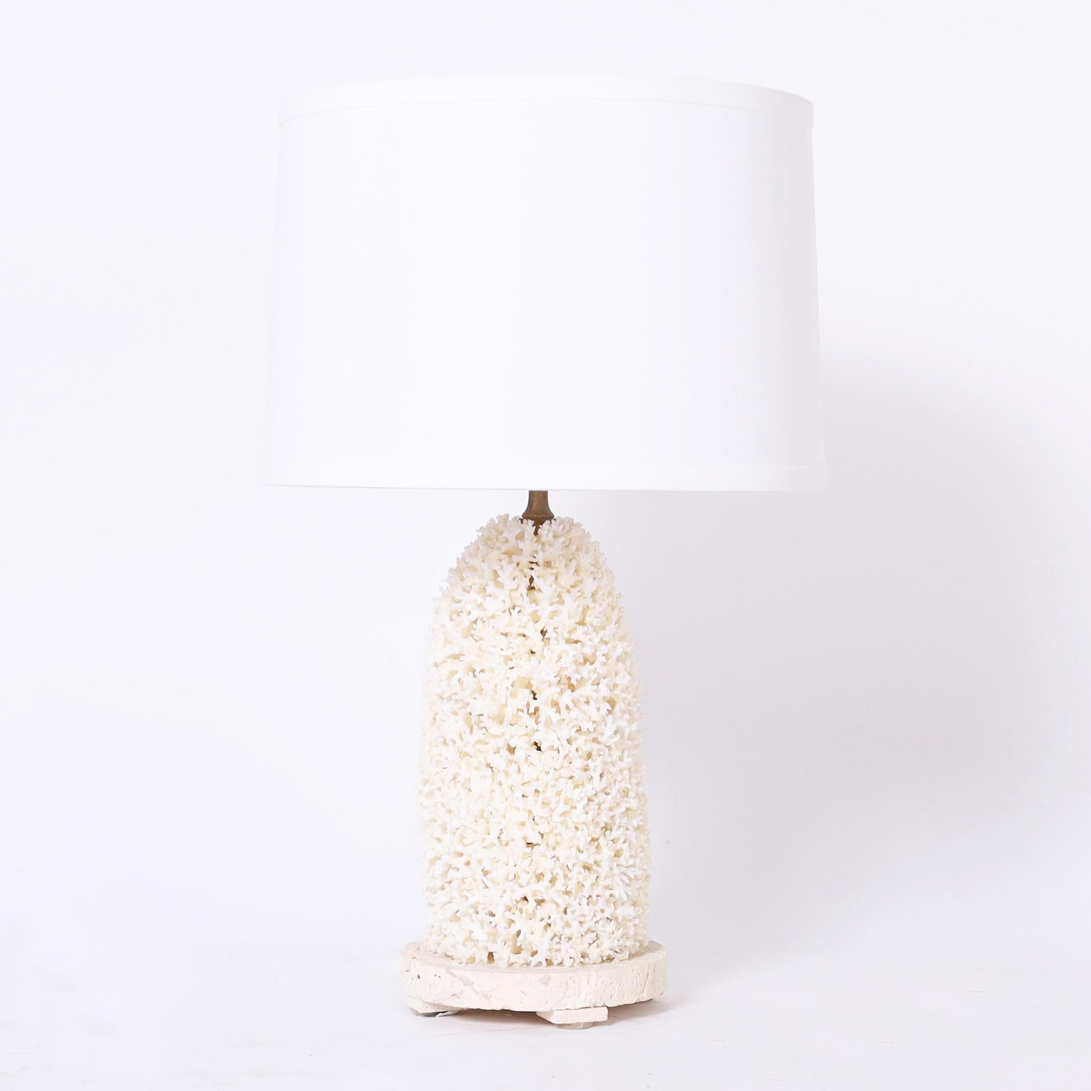 Chic pair of table lamps exclusively designed and handcrafted by FS Henemader Antiques in an ambitious composition using lace coral and presented on coquina stone bases.