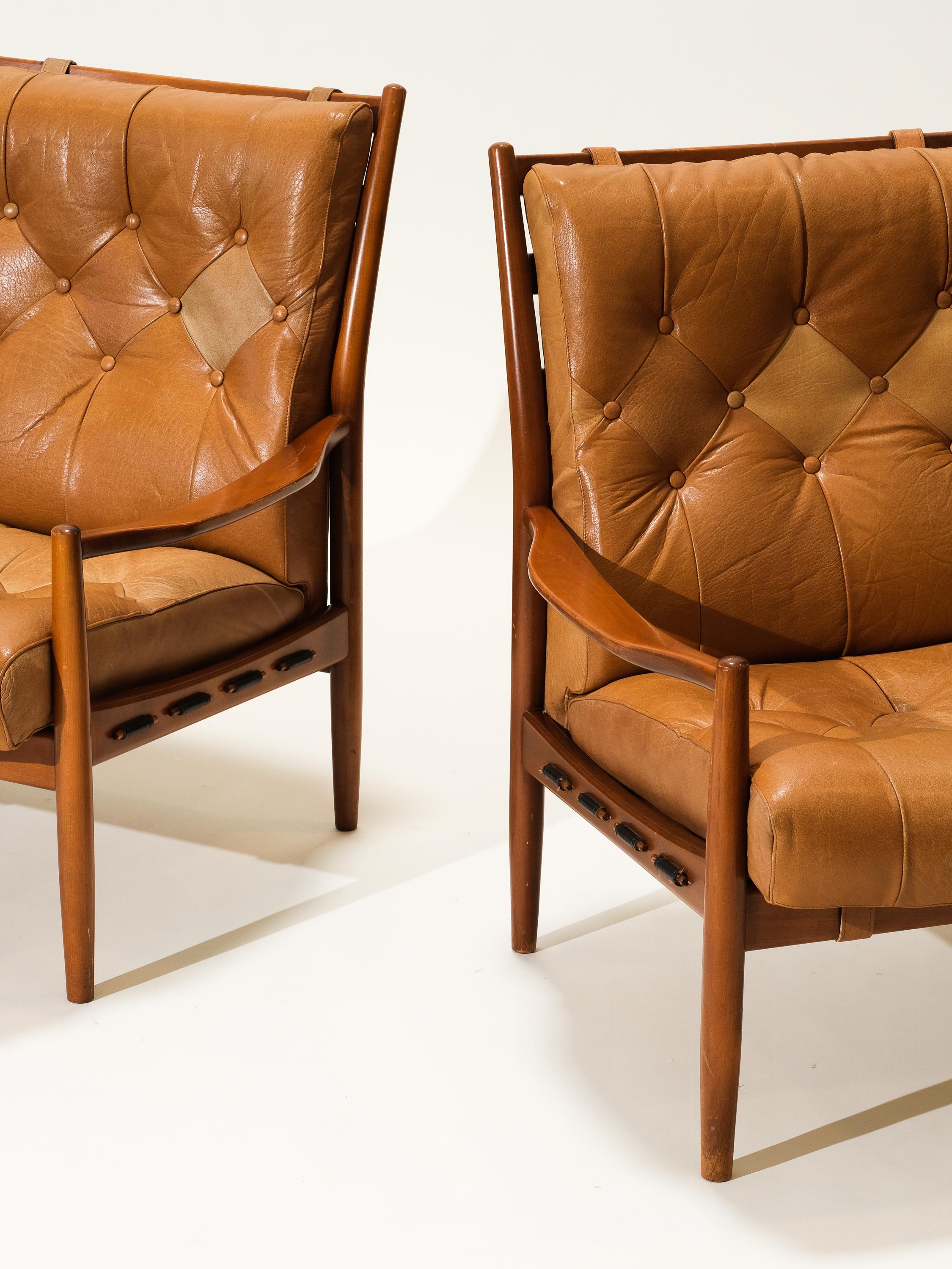 “Läckö” lounge chairs by Swedish designer Ingemar Thillmark. Chairs are manufactured by OPE furniture, Olof Persson Möbler, in Jönköping during the second half of the 20th century.

The frame is made from stained beech and the chairs have two loose