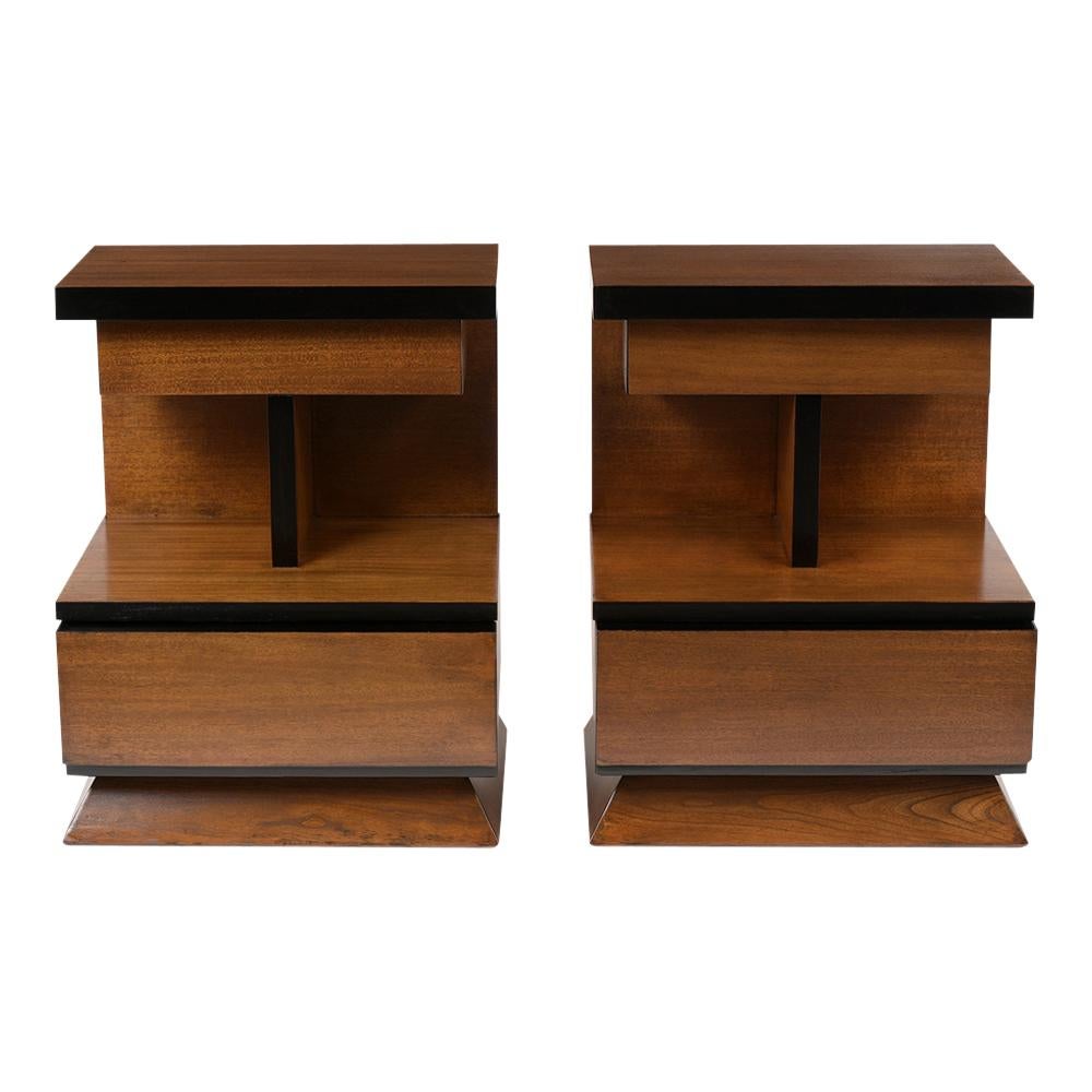 This pair of midcentury style nightstands have been restored and is newly refinished in a walnut and black color combination with a lacquered finish. These symmetric design nightstands come with a small top drawer, in the center has an open shelf