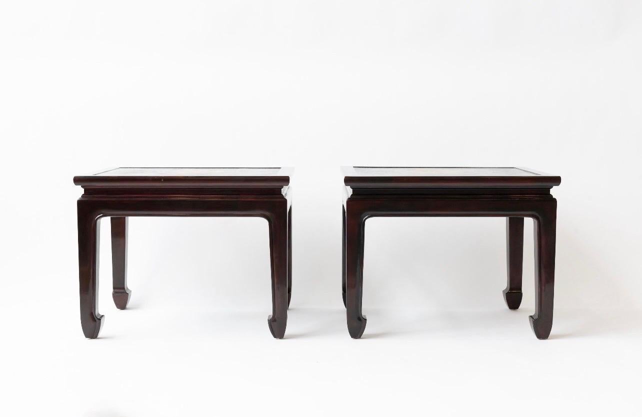 A pair of cashew lacquer, coffee tables, made by Gracie in the early 2000's in their New York art studio.

The tops feature antique pieces of Japanese leather, from samurai armor boxes.  The wood legs and aprons were made to fit the leather pieces,