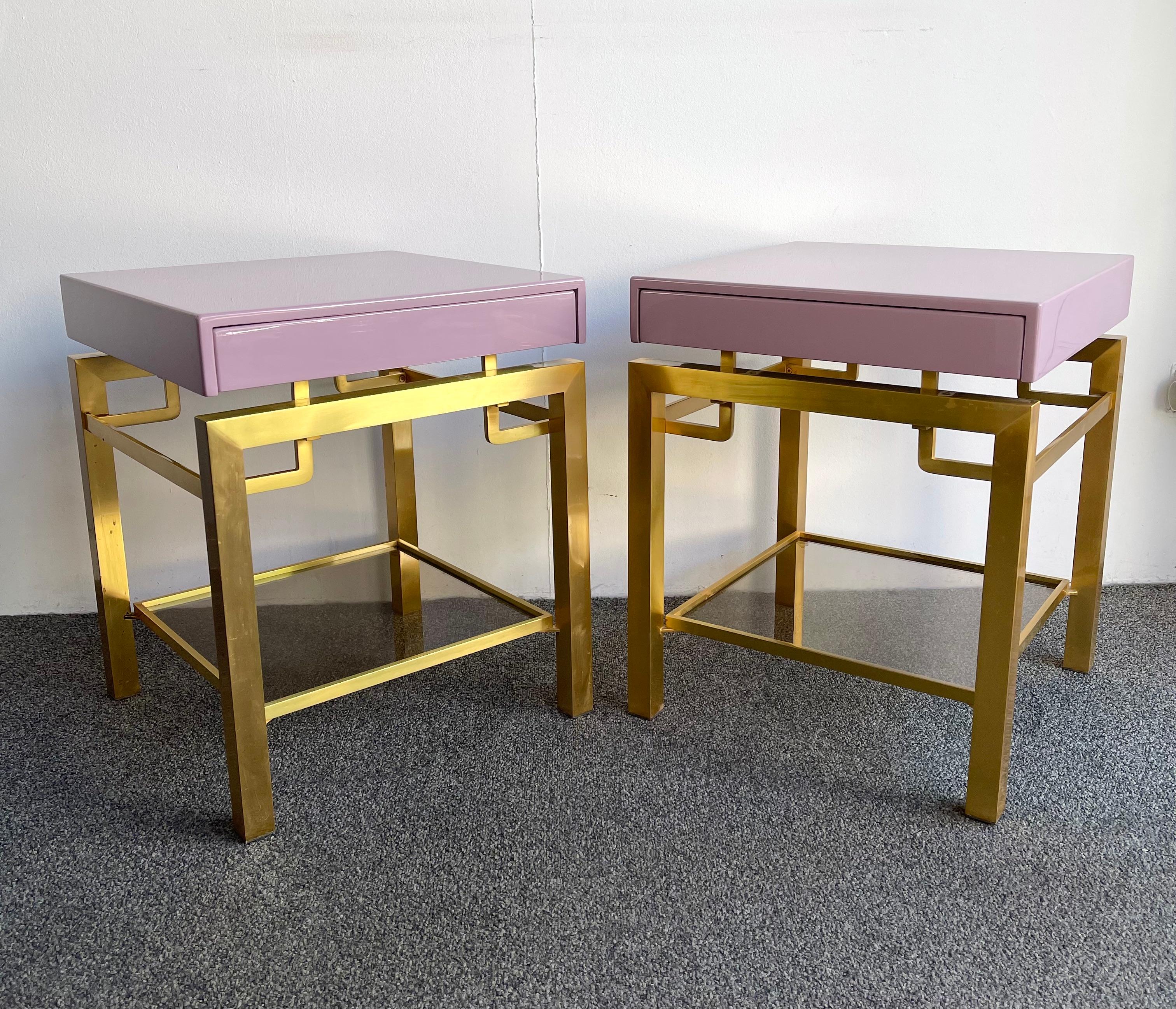 Pair of light pink parma lacquered and brass feet side end low or bedside tables nightstands by Guy Lefèvre. Nice model with drawers. A part of his production was retail by the Maison Jansen in Paris during the 1970s. Famous design like Jean Claude