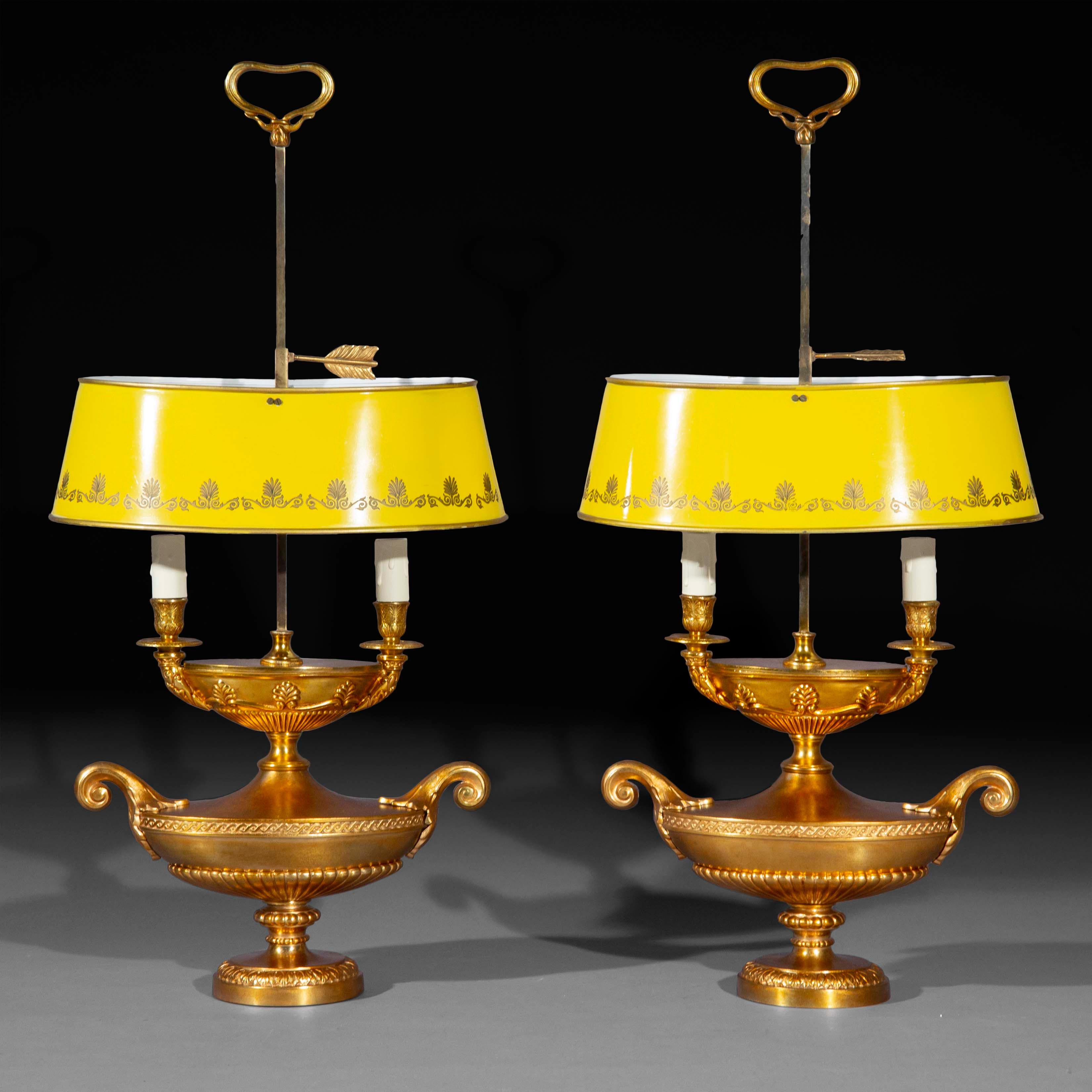 A pair of unusual and decorative lacquered brass 'bouillotte' table lamps, fashioned as Ancient Roman oil lamps, each for two lightbulbs and with adjustable yellow 'tôle peinte' shades
France or Italy, early to mid-20th century.

Why we like