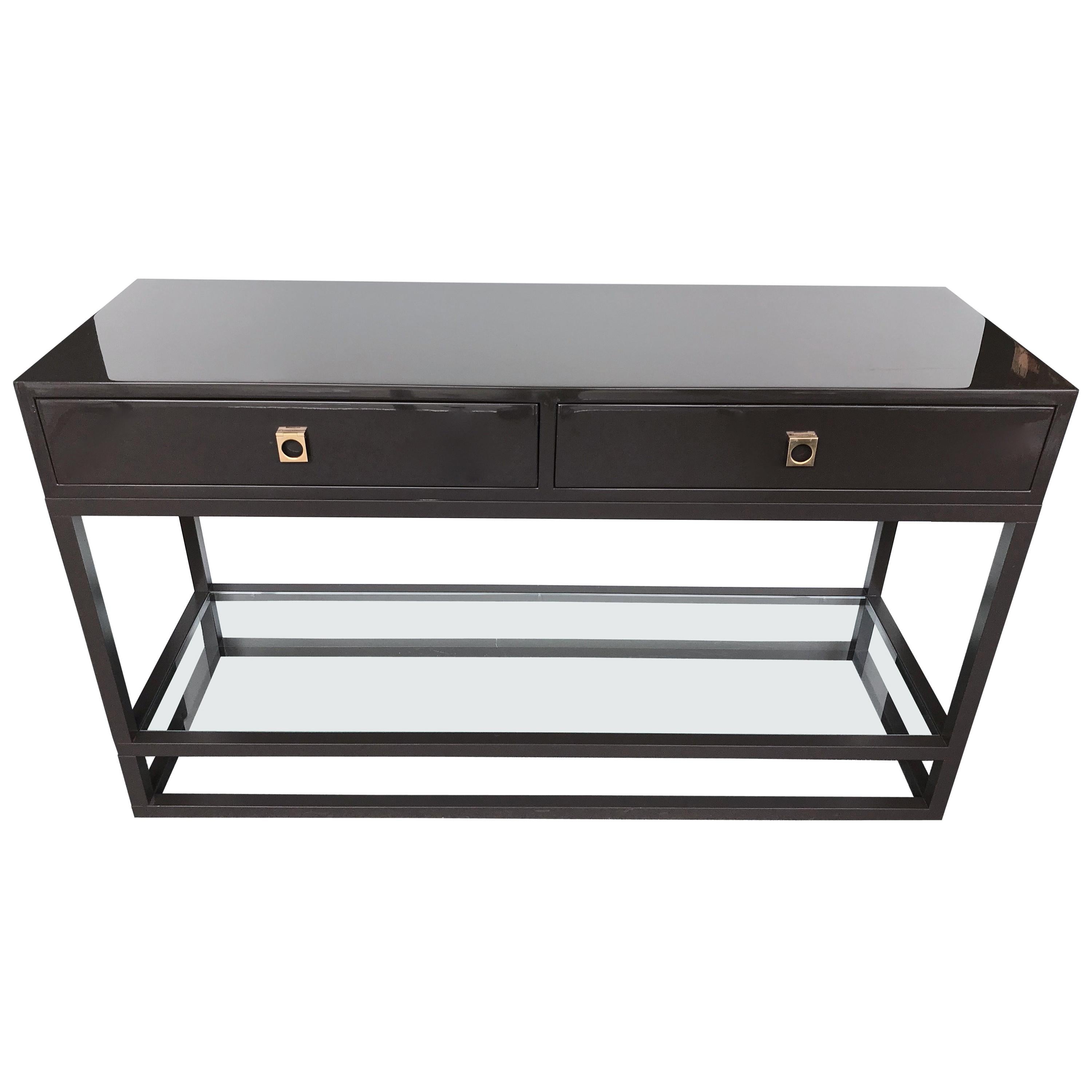 Rare pair and model of lacquered console table with drawers in an unusual grey lacquer, brass handle, low glass shelf by the designer Guy Lefevre for Maison Jansen. Special feet from the late 1970s in the Lefevre production, was called 