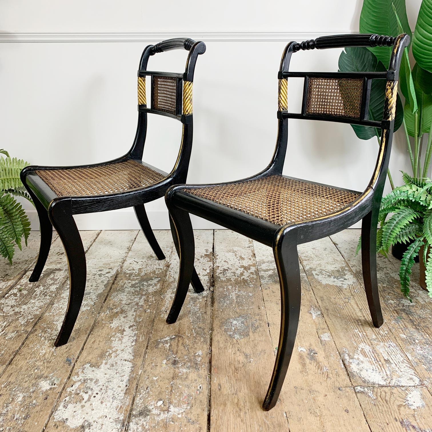 English Pair of Black Ebonised and Parcel Gilt Egyptian Revival Regency Chairs