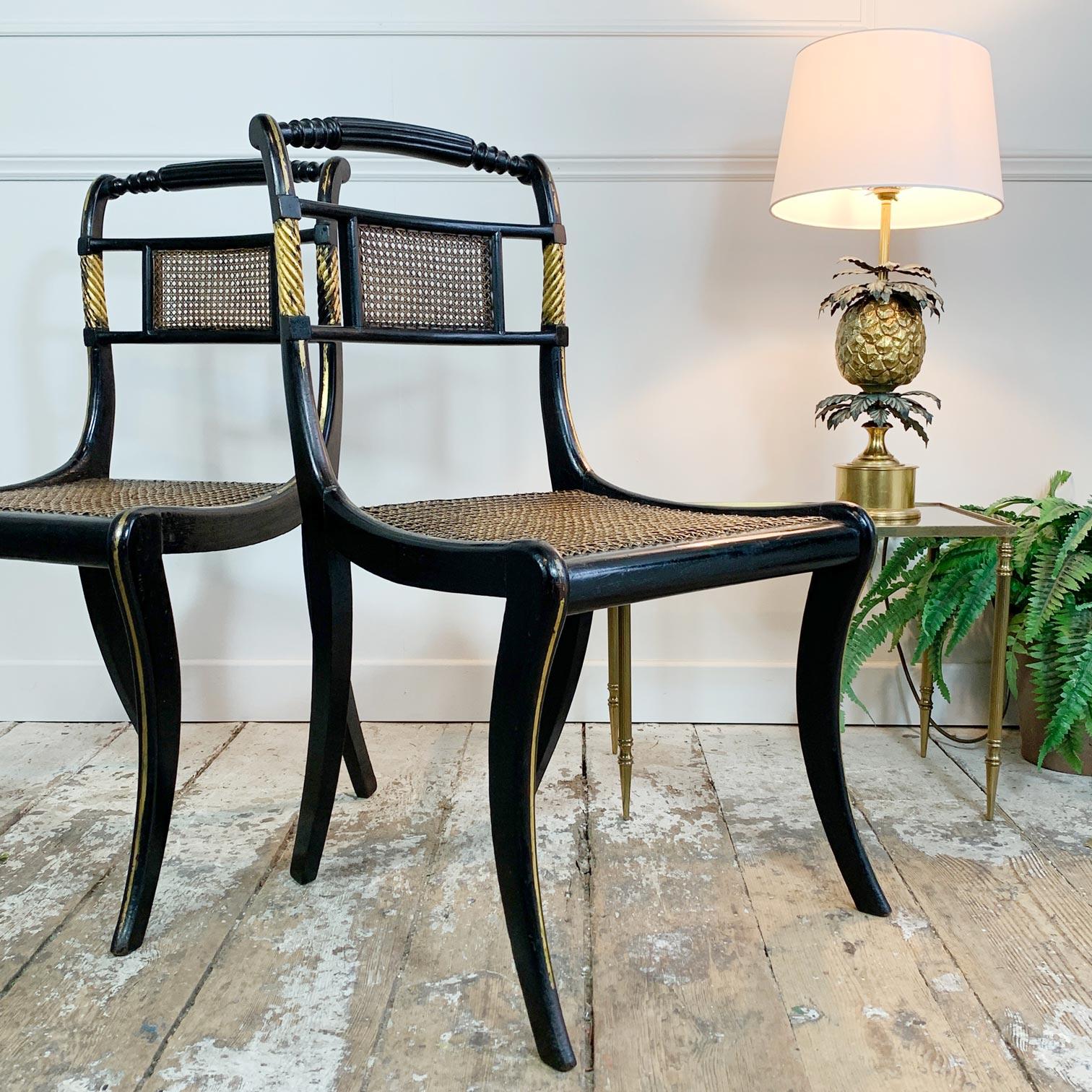 Wood Pair of Black Ebonised and Parcel Gilt Egyptian Revival Regency Chairs