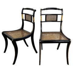 Pair of Lacquered Ebonised and Parcel Gilt Egyptian Revival Regency Chairs