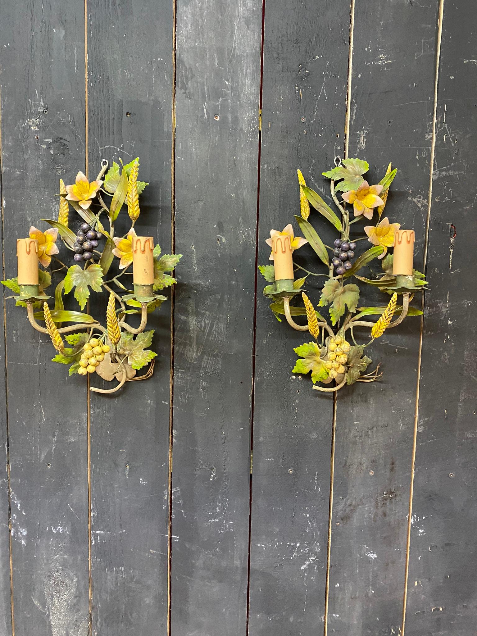 Pair of lacquered metal sconces, circa 1960
decorated with grapes and ears of wheat.