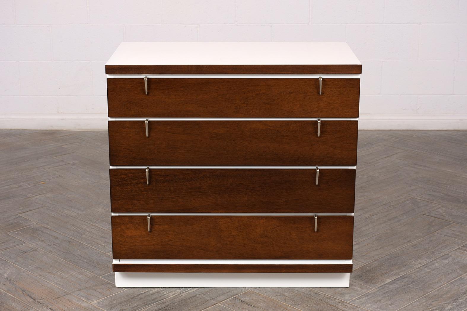 This set of mid-century chests of drawers is completely restored by our team of craftsmen and is newly stained in dark walnut & white color combination with a lacquered finish. These dressers come with four large drawers with chrome pulls and rests