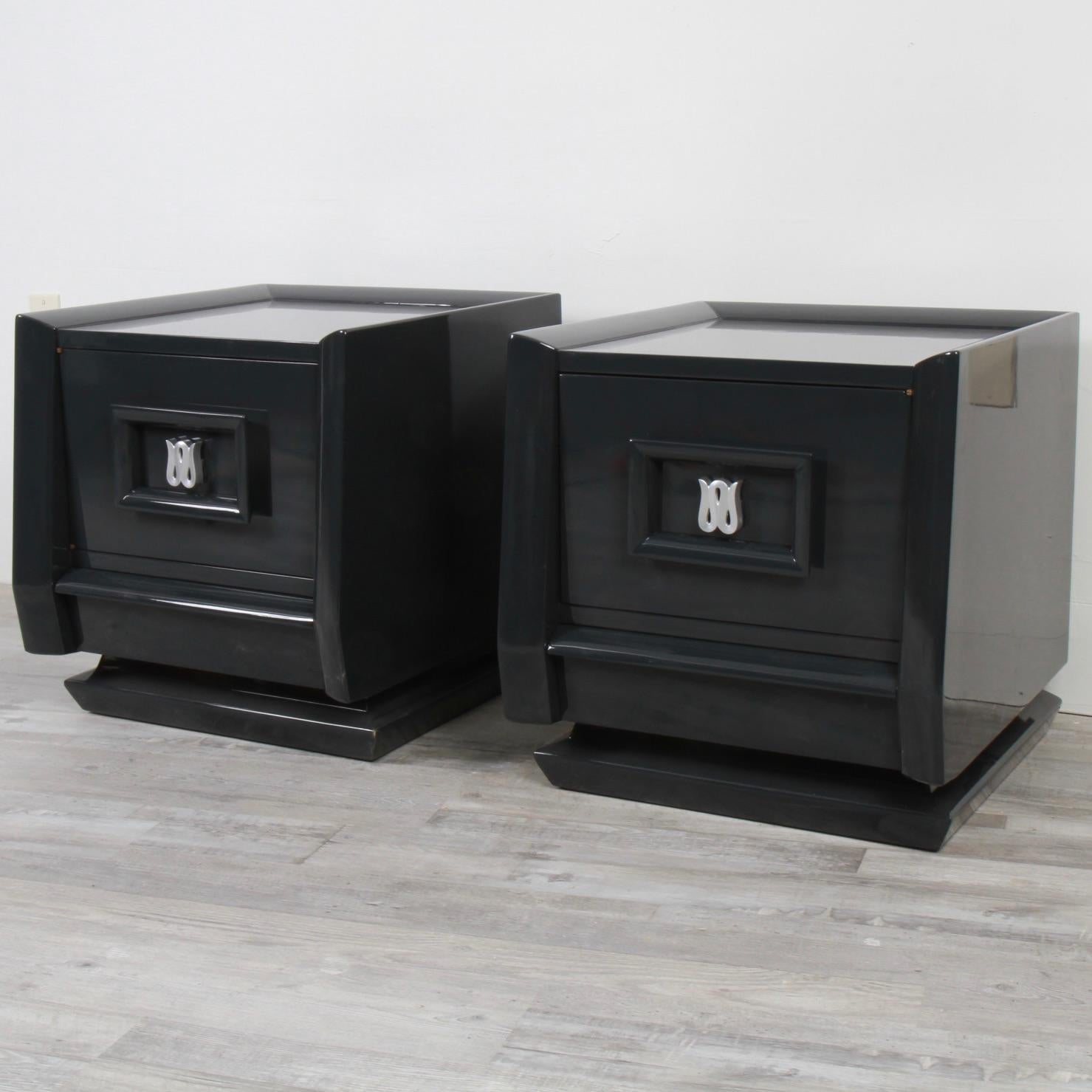 Design wise these were nice in their original blonde mahogany, but they look even better in their new graphite grey lacquer. Made in the early 60s by Carlton House furniture, these nightstands feature a single drawer cabinet with a lower drawer.