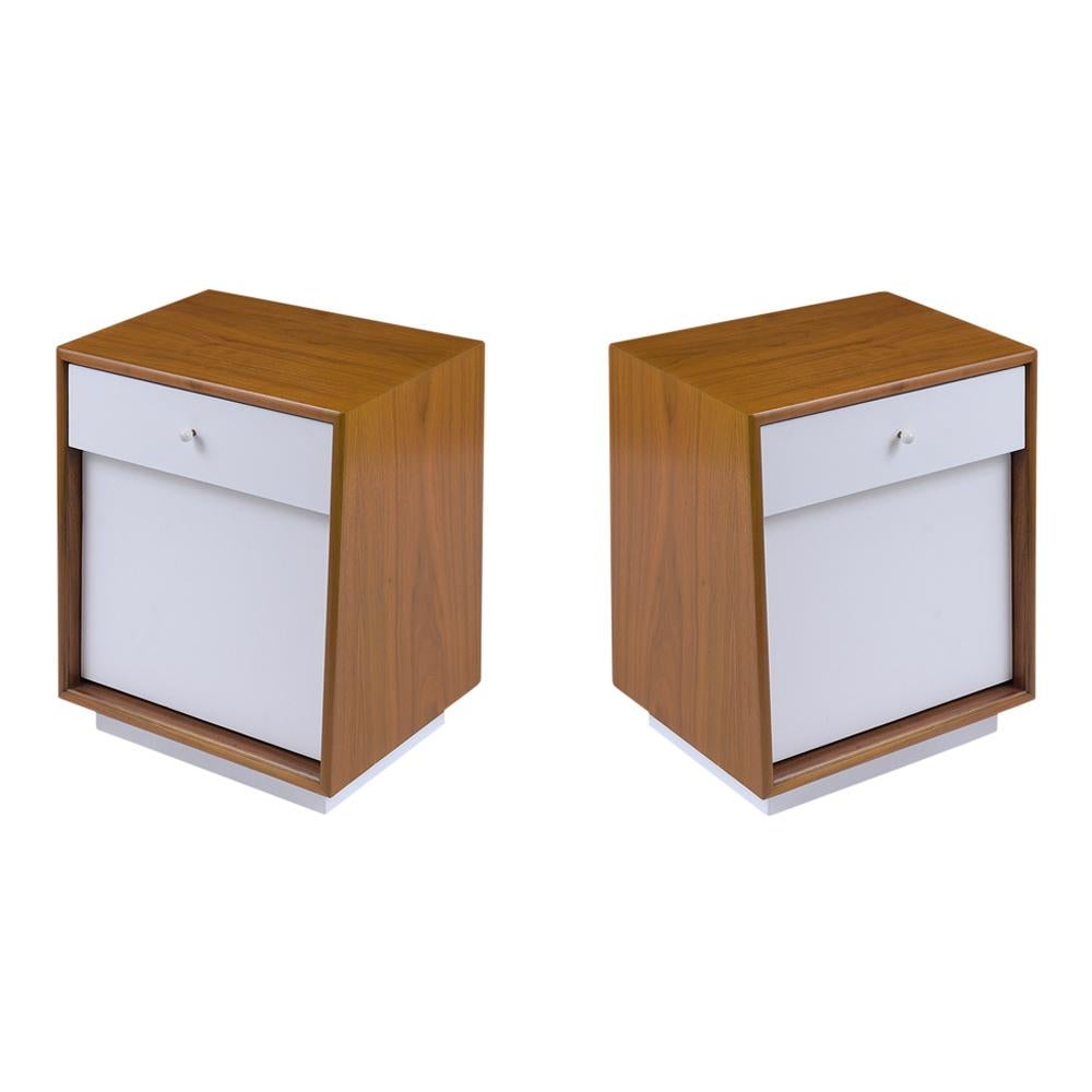 An extraordinary pair of modern bedside tables crafted out of walnut professionally restored by our team of expert craftsmen. This fabulous set of nightstands features light walnut and off-white color combination with a lacquered finish. a single