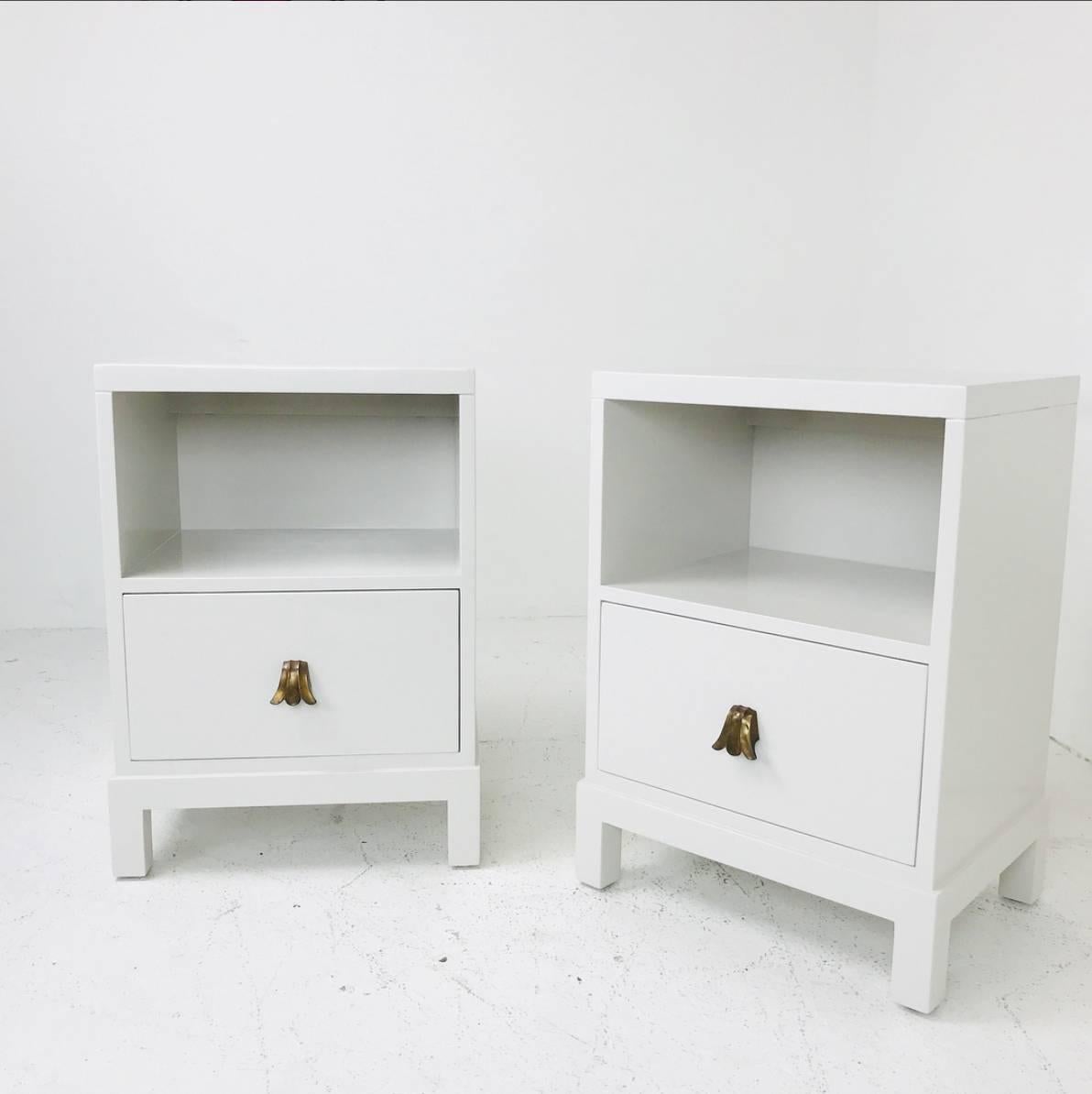 Pair of lacquered nightstands/side tables by Widdicomb. Newly refinished in a soft light gray lacquer.

dimensions: 18.5