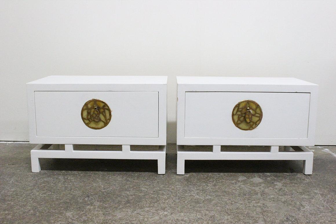 Pair of lacquered nightstands / side tables by Frank Kyle with hardware by Pepe Mendoza. There is visible wear from age and use and refinishing is recommended.

Dimensions: 
27
