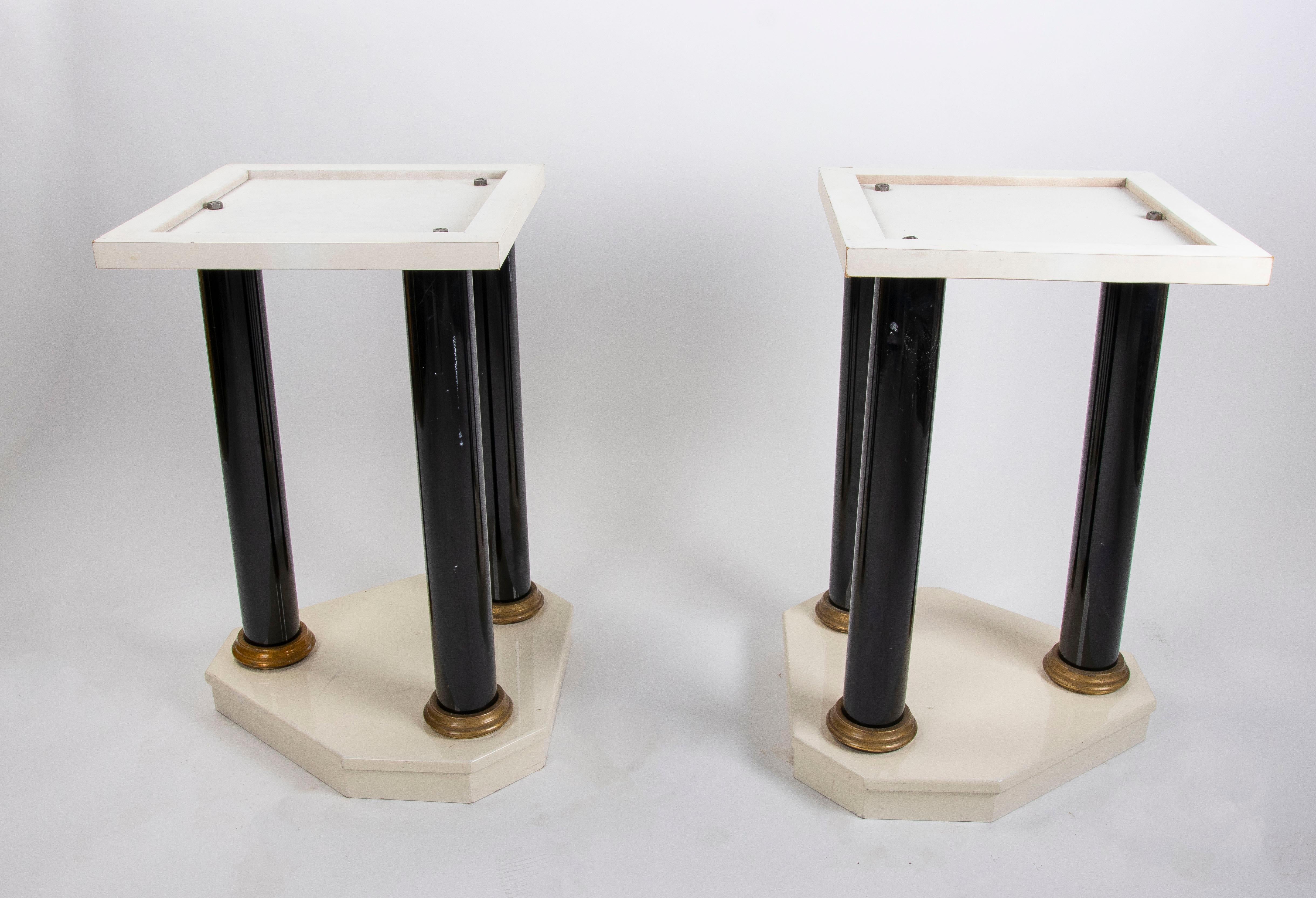 Pair of Lacquered Wood Table Legs with Bronze Columns and Bases.

The measurements of the upper part are 44x44cm