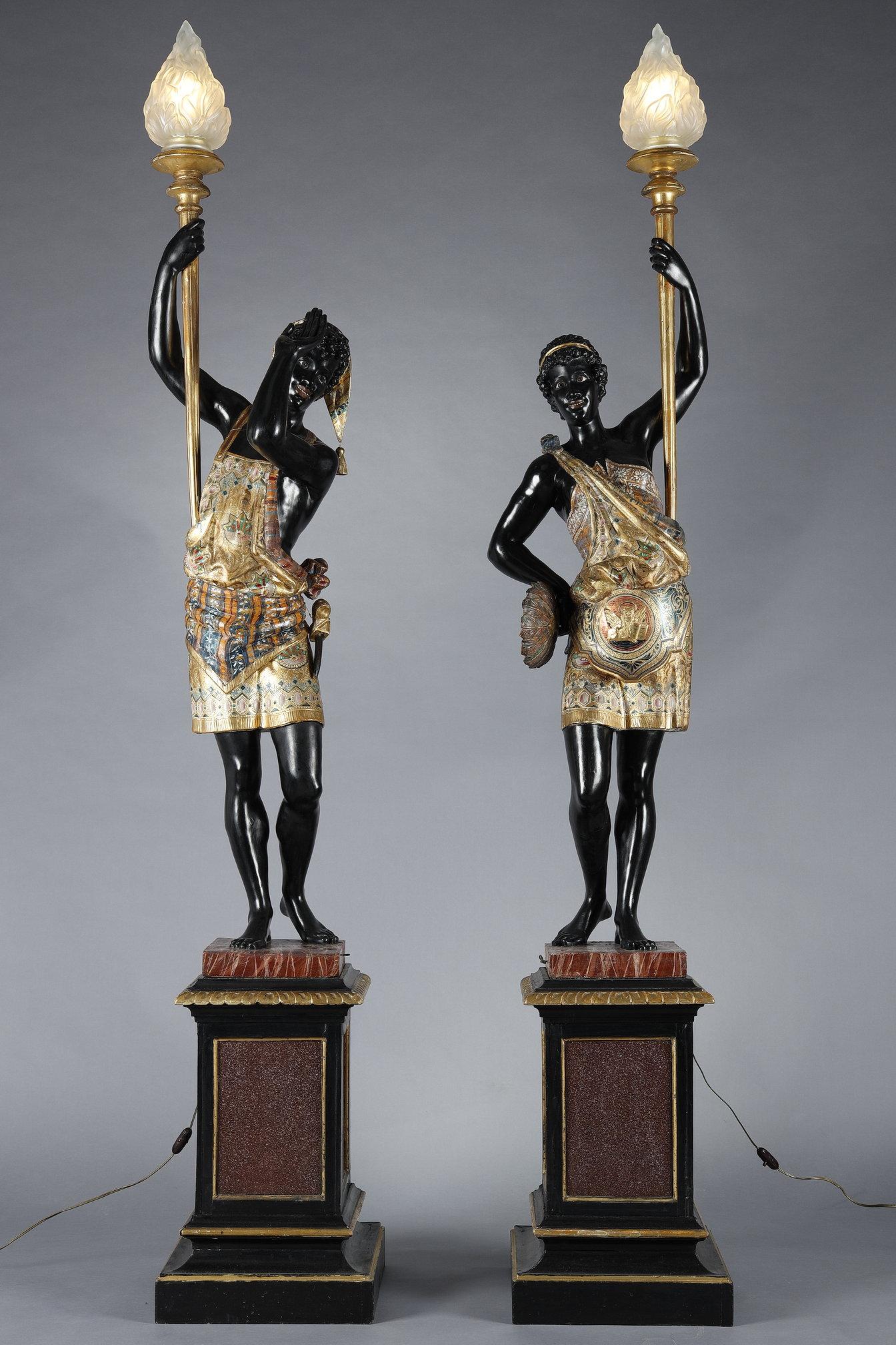 Italian Pair of lacquered wood torchholders depicting Nubians For Sale