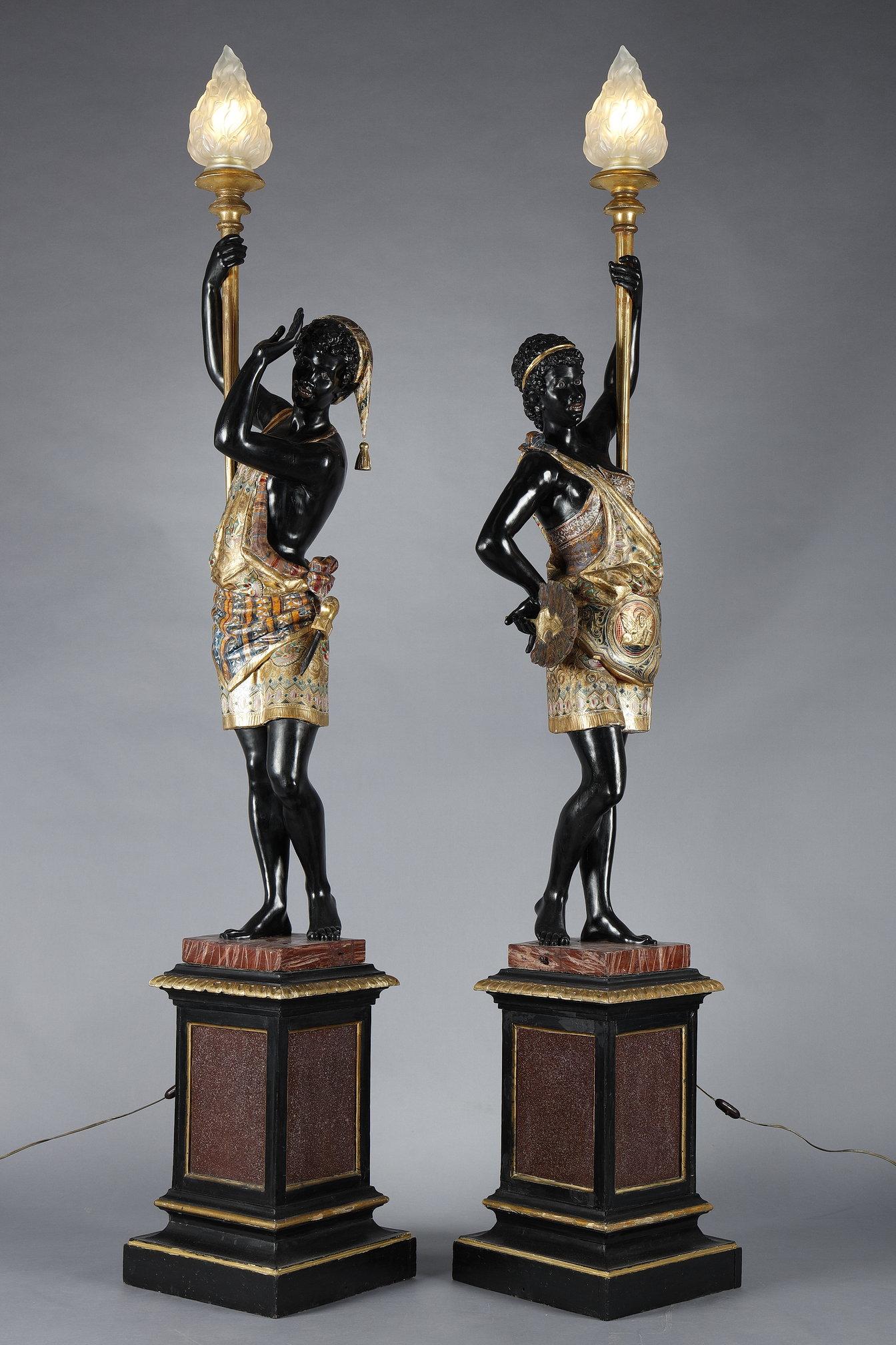 Lacquered Pair of lacquered wood torchholders depicting Nubians For Sale