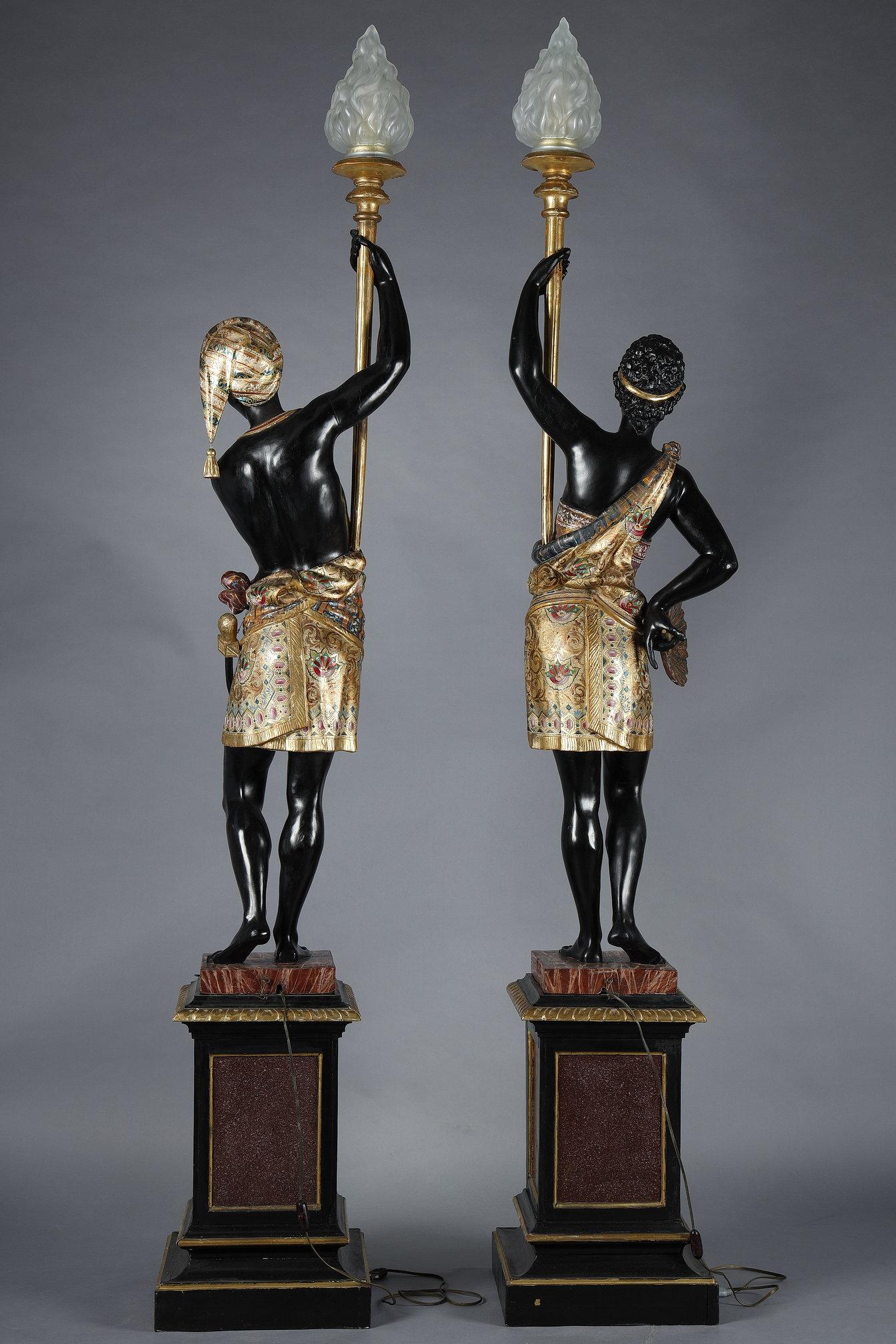 Mid-19th Century Pair of lacquered wood torchholders depicting Nubians For Sale