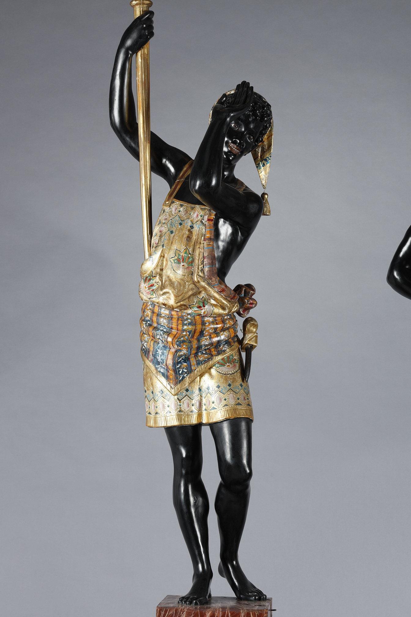 Wood Pair of lacquered wood torchholders depicting Nubians For Sale