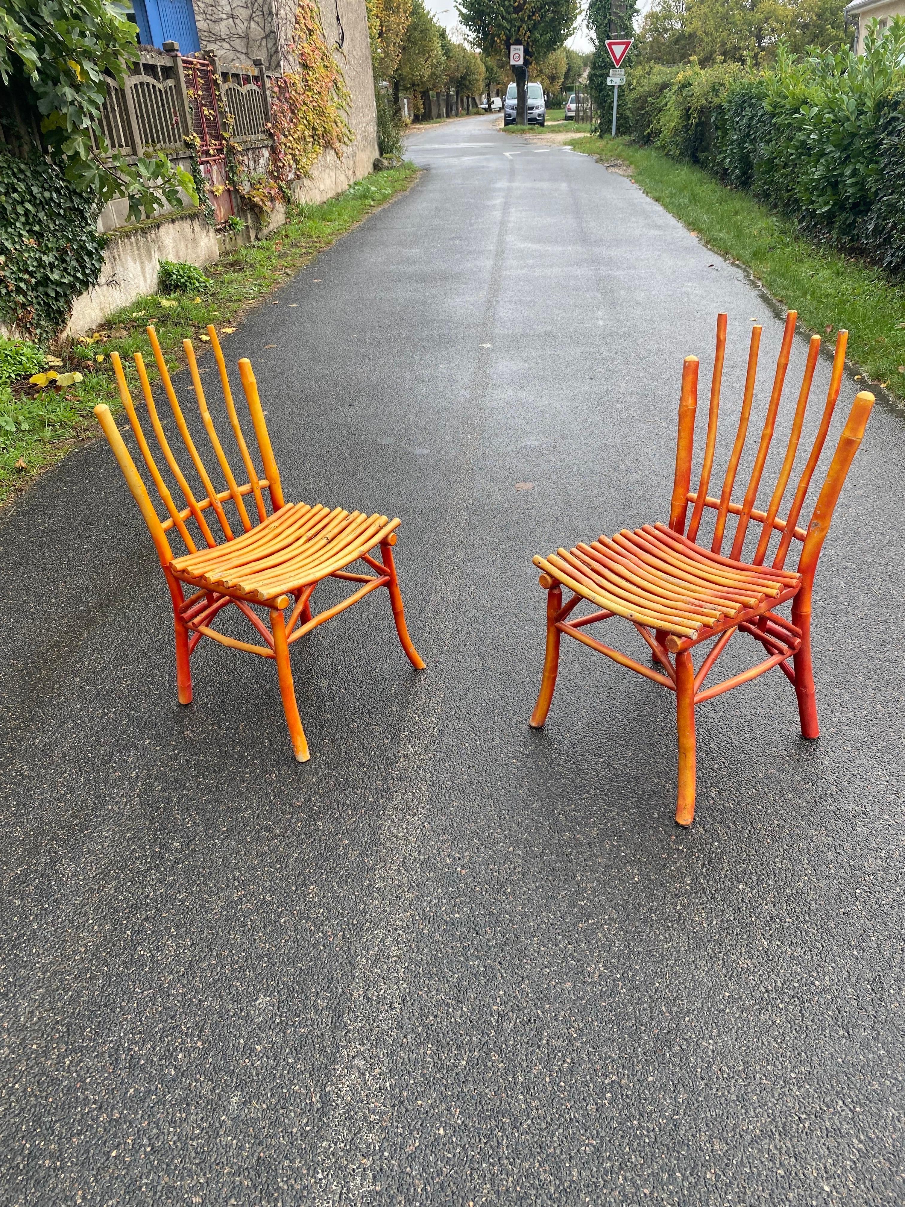Pair of lacquered wooden chairs, imitating bamboo circa 1950;
structure in very good condition, small lack of paint.