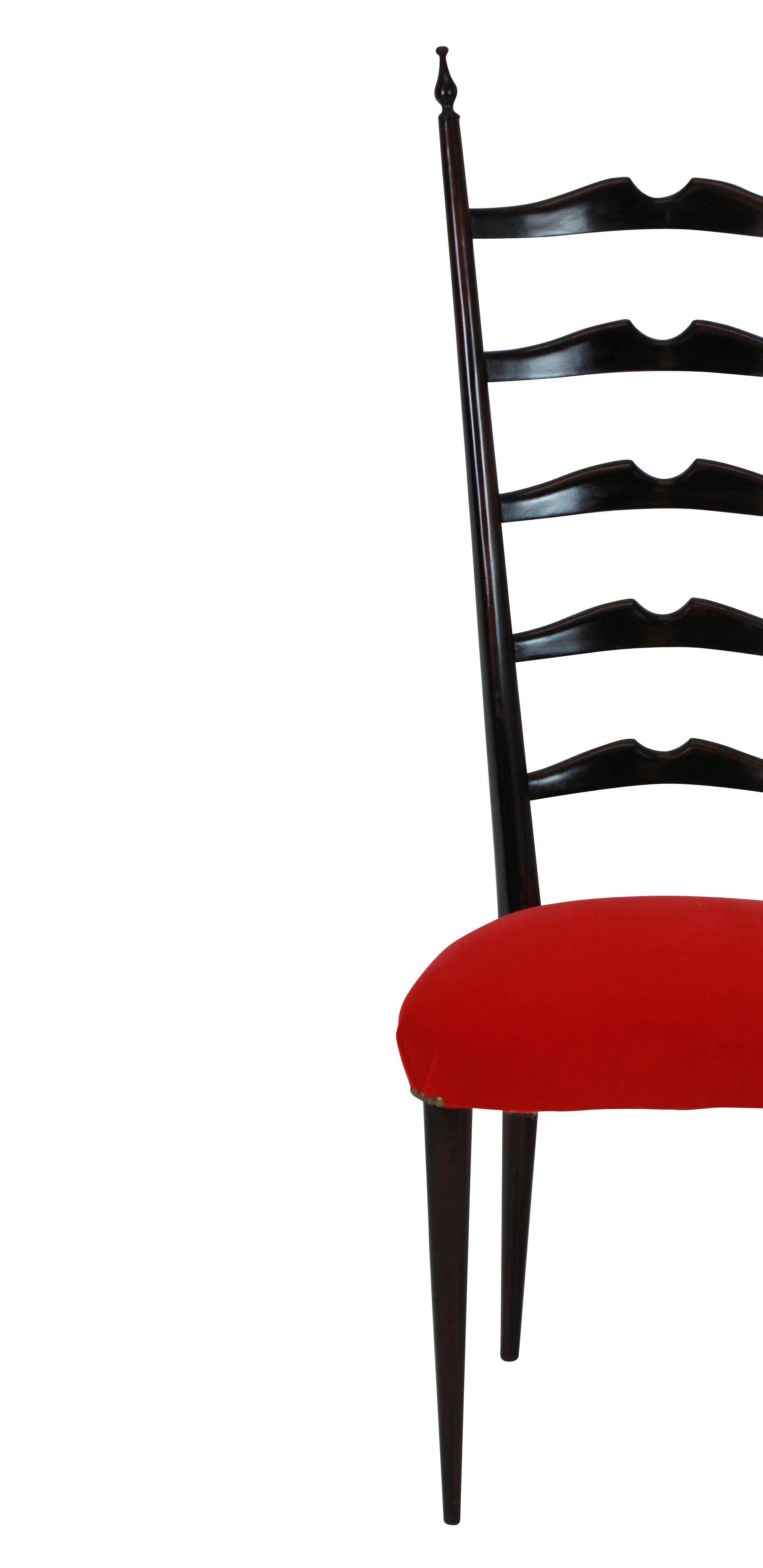 A set of two elegant curved ladder back hall chairs in the manner of Paolo Buffa. Newly upholstered in scarlet velvet.

