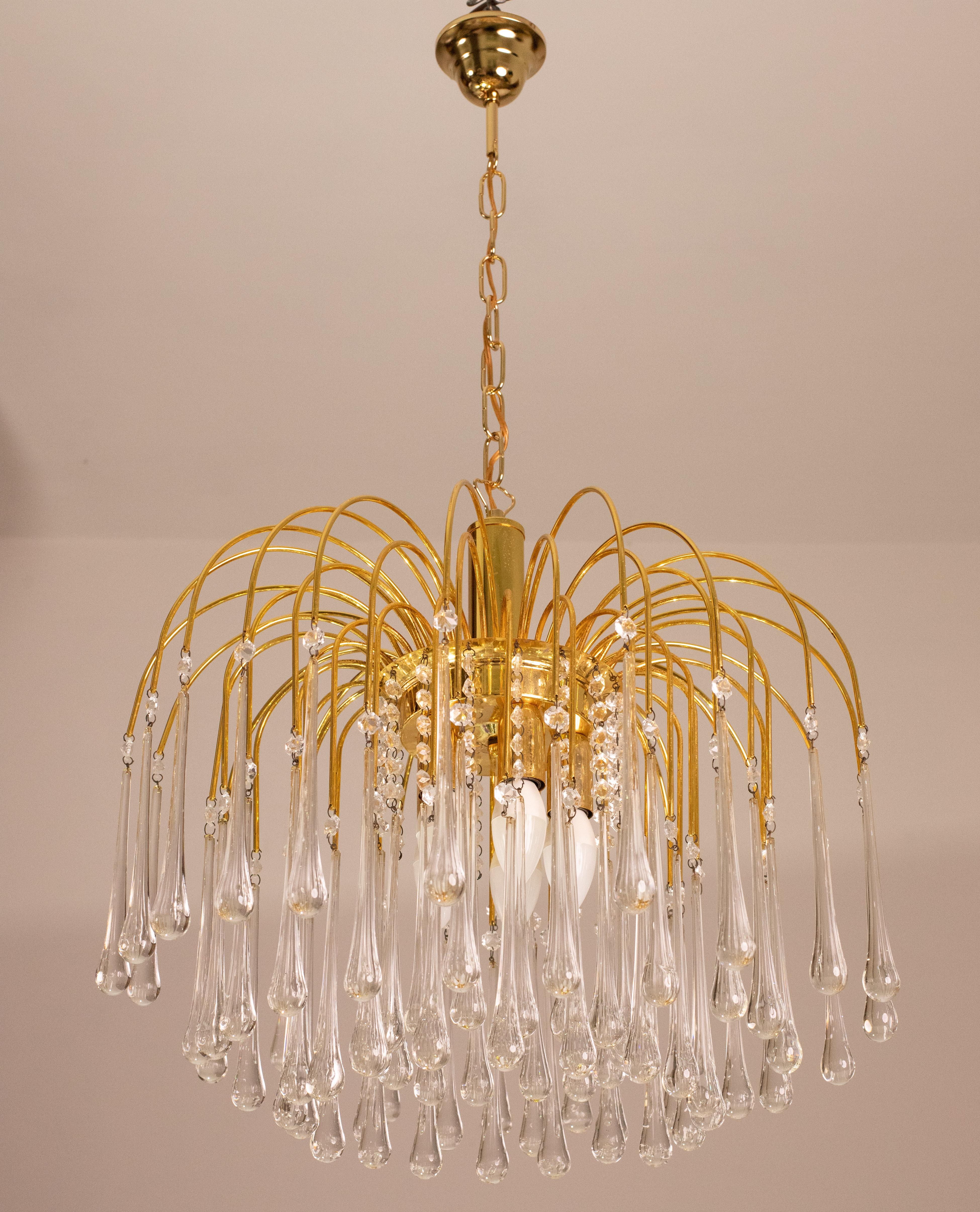 Gorgeous and unique pair of Murano chandeliers in the style of Venini La Cascata.
The structures are in good aesthetic condition.
The chandeliers consist of four rounds composed of beautiful white drops cascading down and alternating with beads.
The