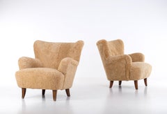 Pair of 'Laila' Armchair in sheepskin by Ilmari Lappalainen, Finland, 1950s