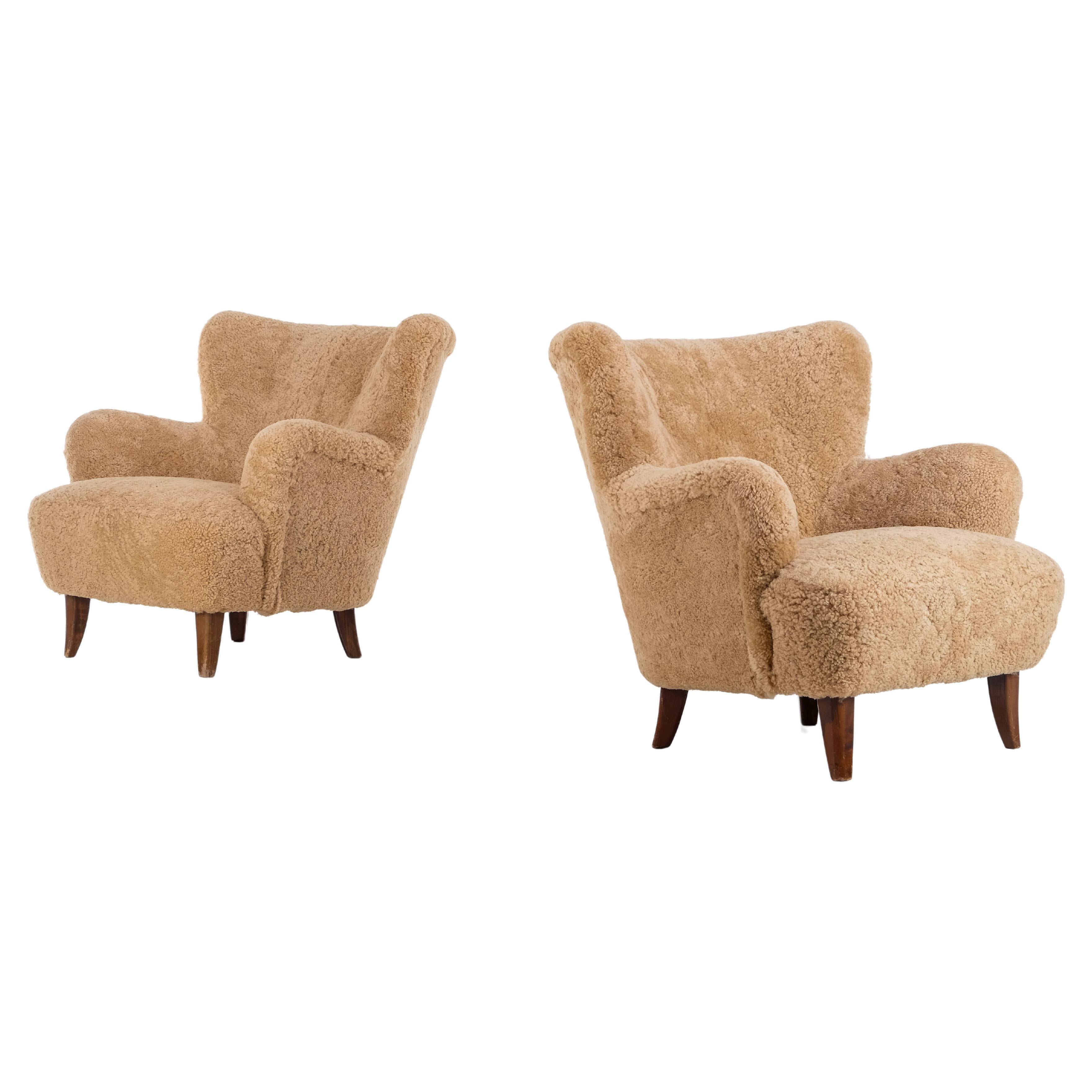 Pair of 'Laila' Armchair in sheepskin by Ilmari Lappalainen, Finland, 1950s For Sale