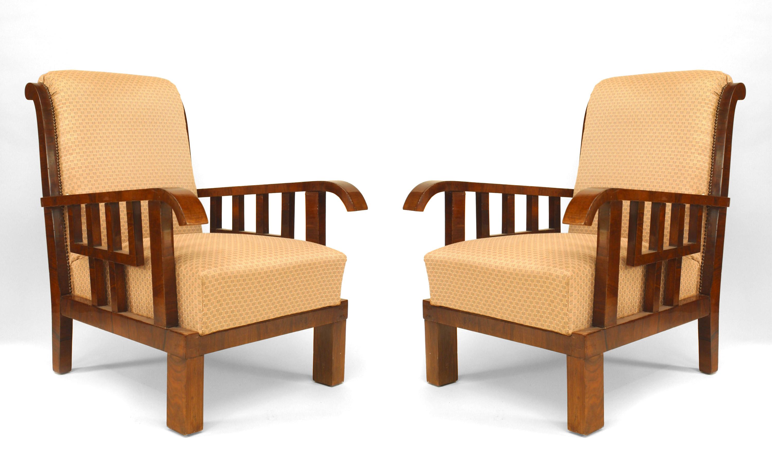 Pair of Art Deco (Hungarian) walnut Armchairs with geometric open design form under arms with upholstered seat and back supported on square legs (LAJOS KOZMA)
