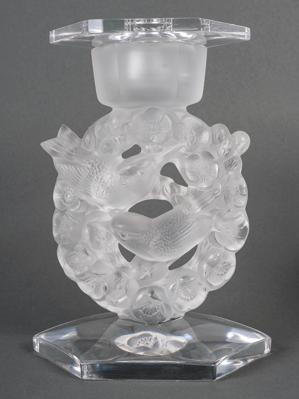 Pair of Lalique France crystal candelabras, 20th Century.

A pair of Lalique France crystal candelabra, flowers and birds, 20th Century.
h:18cm, d: 13cm