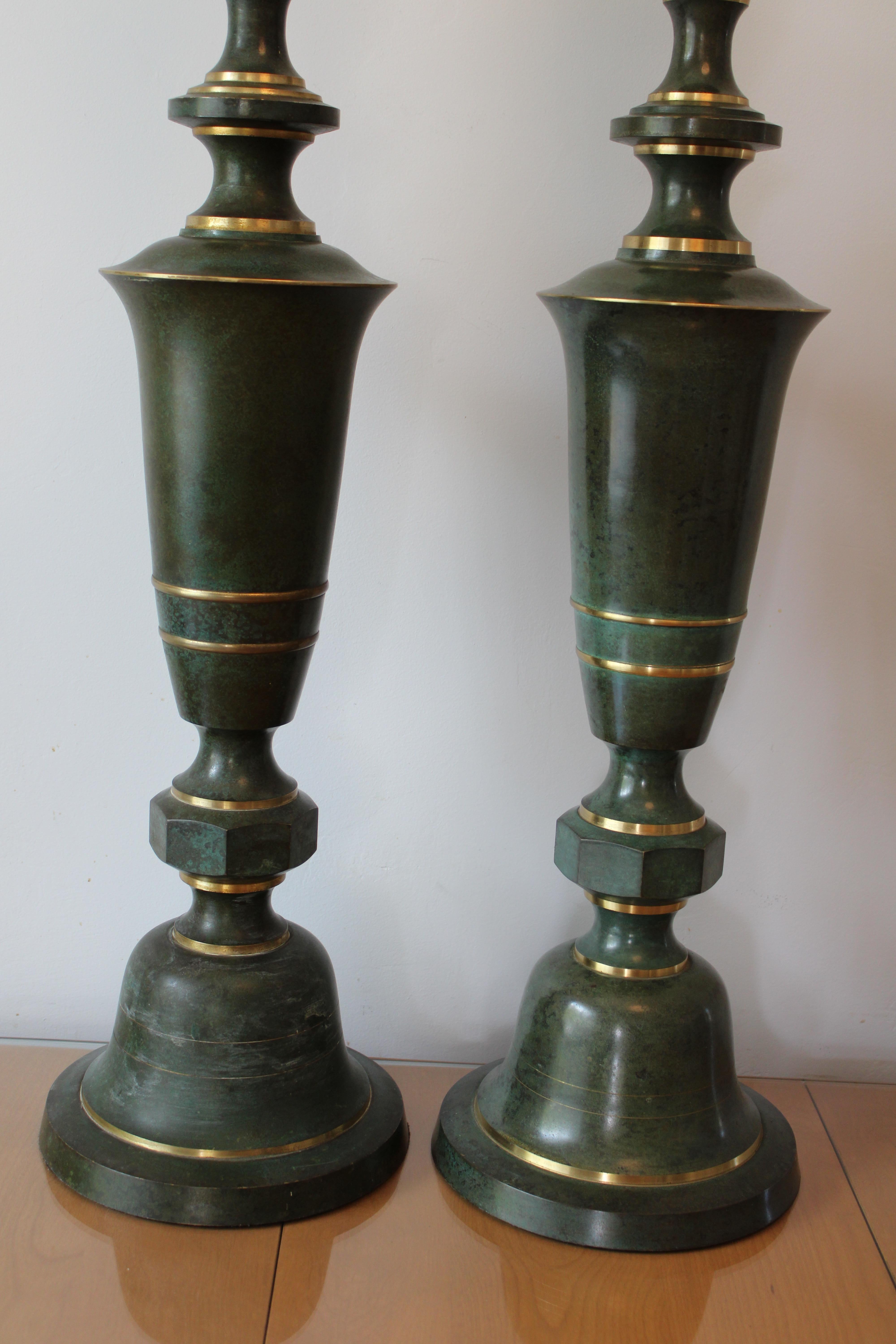 A wonderful pair of brass and copper lamps attributed to Carl Sorensen.  Each lamp measures 33