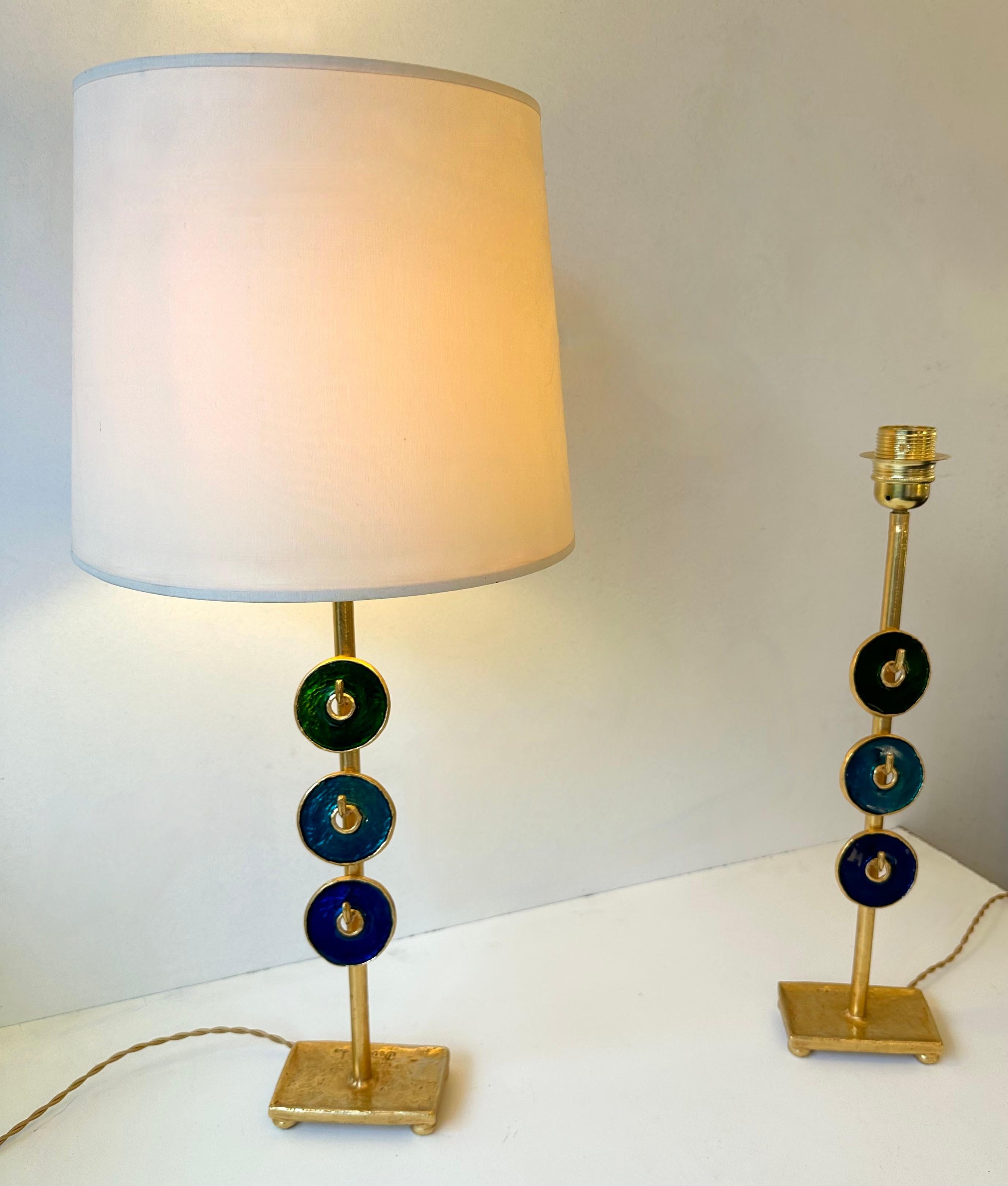 Pair of table or bedside lamps in gilt metal bronze style and enamel by Nicolas Dewael for Fondica. Sign Dewael. Famous artist who have worked for the manufacture like Pierre Casenove, Stéphane Galerneau, Mathias. In the style of Garouste et
