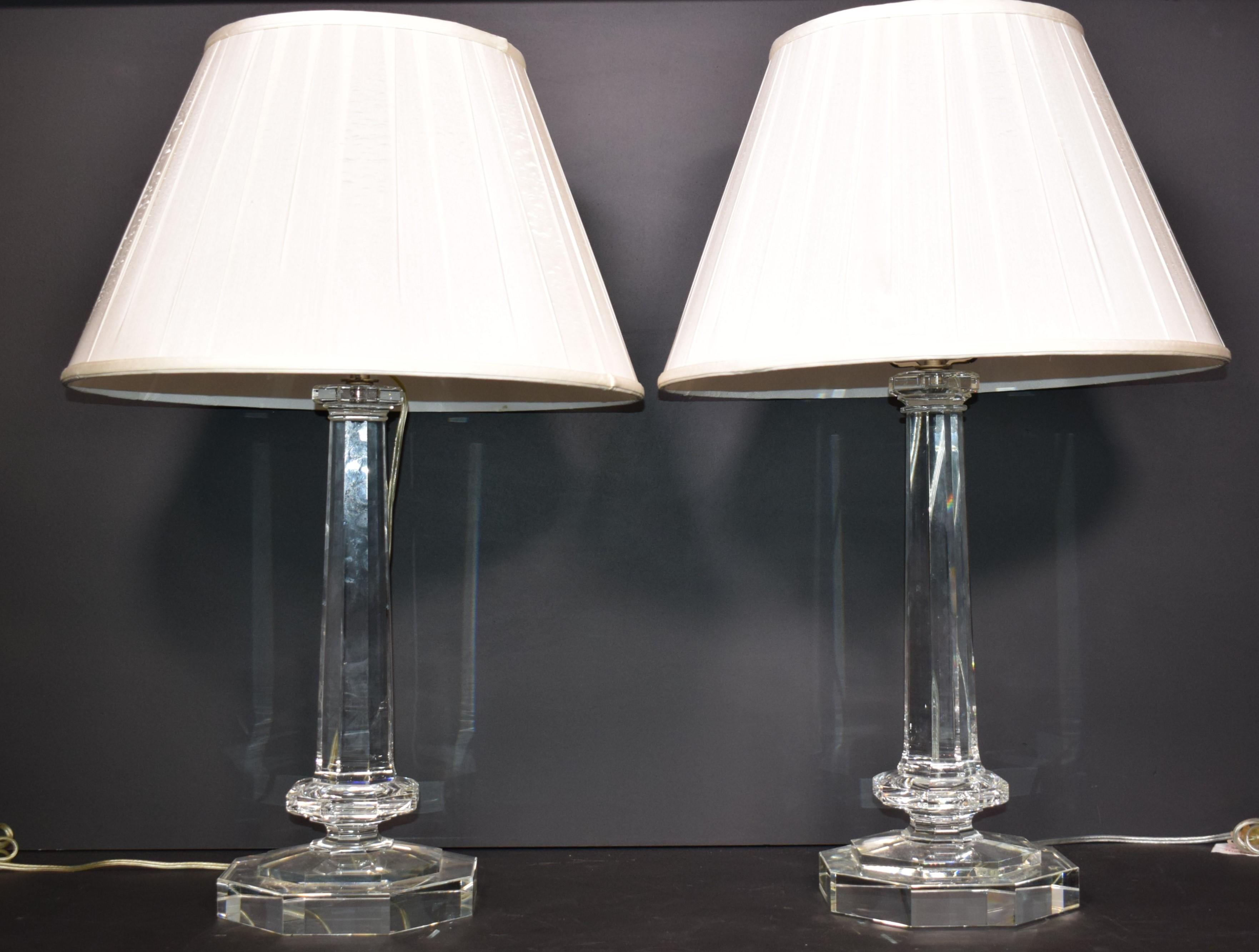 A very fine pair of hand cut crystal lamp bases (different tops, see photo). Exquisite Detail. Fitted with a pair of shades ( fabric to be replaced).
France, circa 1980.
Height without shades 23 1/