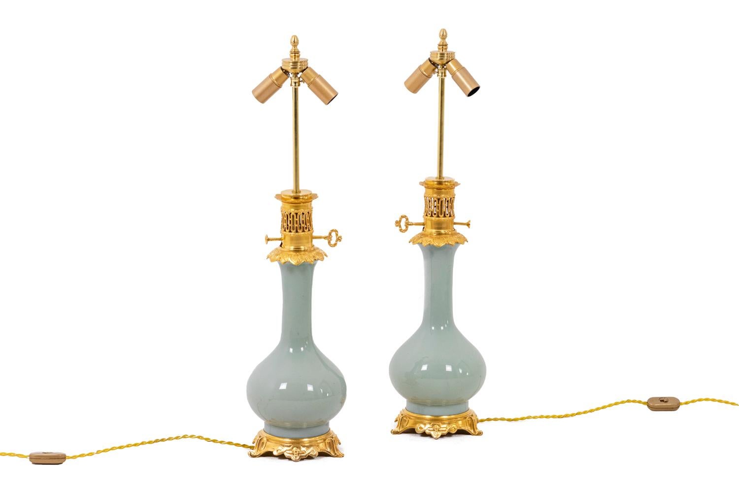 Pair of lamps in celadon porcelain and gilt bronze, plain color. Frame in gilded bronze. Quadripod base.

French work realized circa 1880.

!The price doesn’t include the lampshade price. However, our workshop can advise you with pleasure and