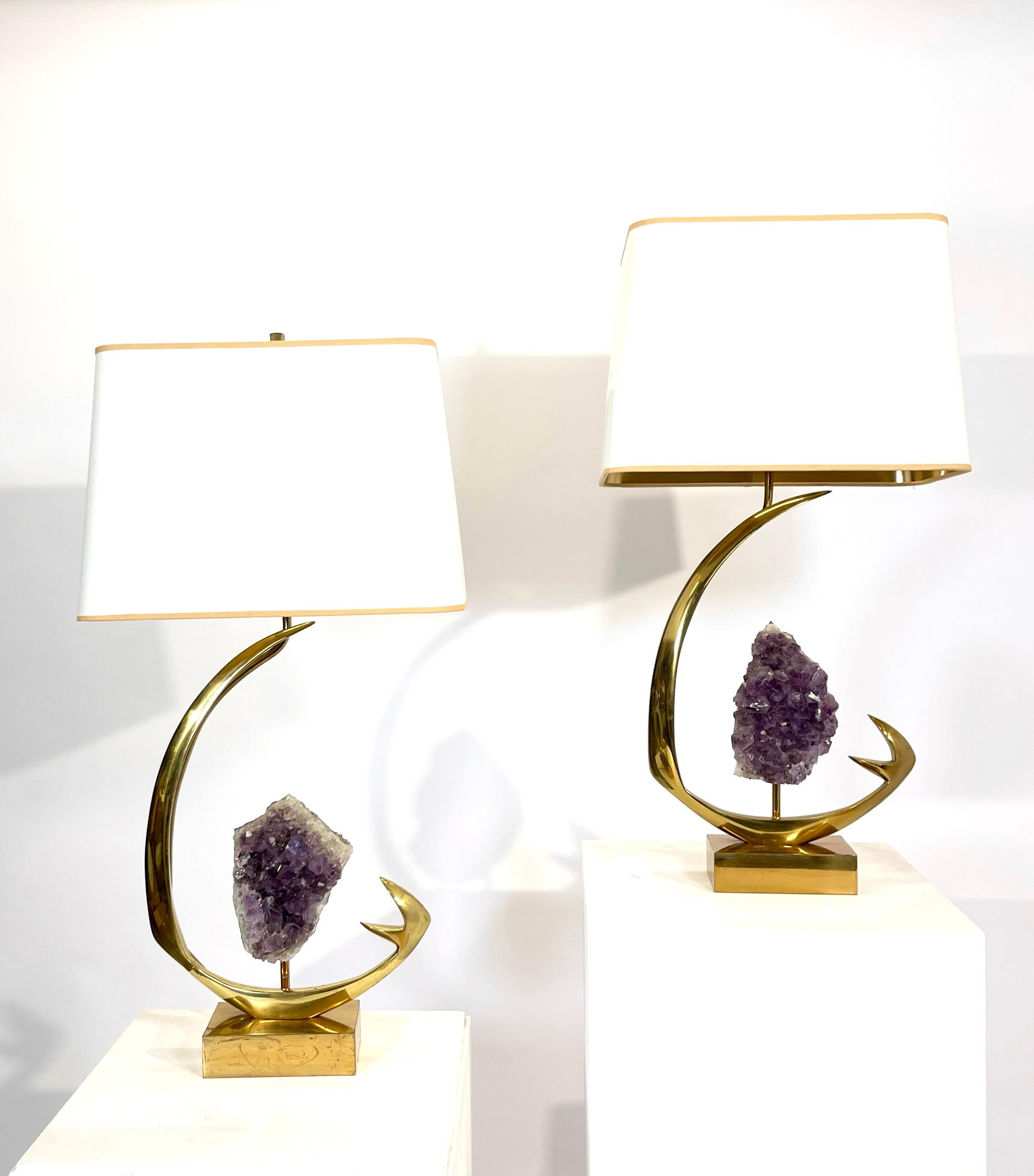 From the 1970s comes this pair of table lamps in sculptural brass and amethyst. The lamps received new electric al wires according to the latest safety standards and new polish. Signed by the artist. 
The lamps are sold without the shade.