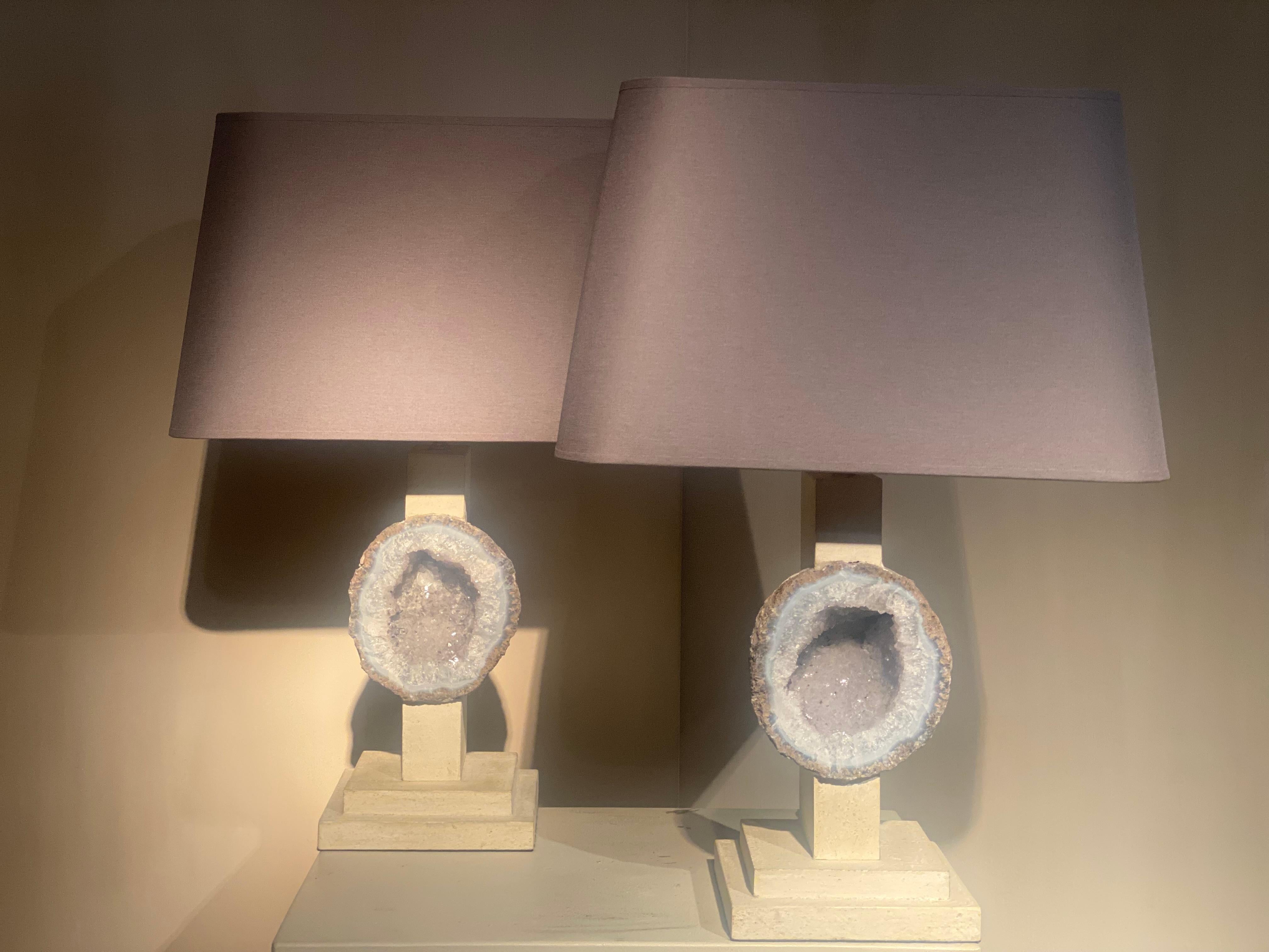 An original pair of Lampshades made out of 2 stones of Rock Crystal,
mounted on a wooden base and stand,
finished with a rectangular lamp shade in a Taupe Color,
very decorative lighting objects,