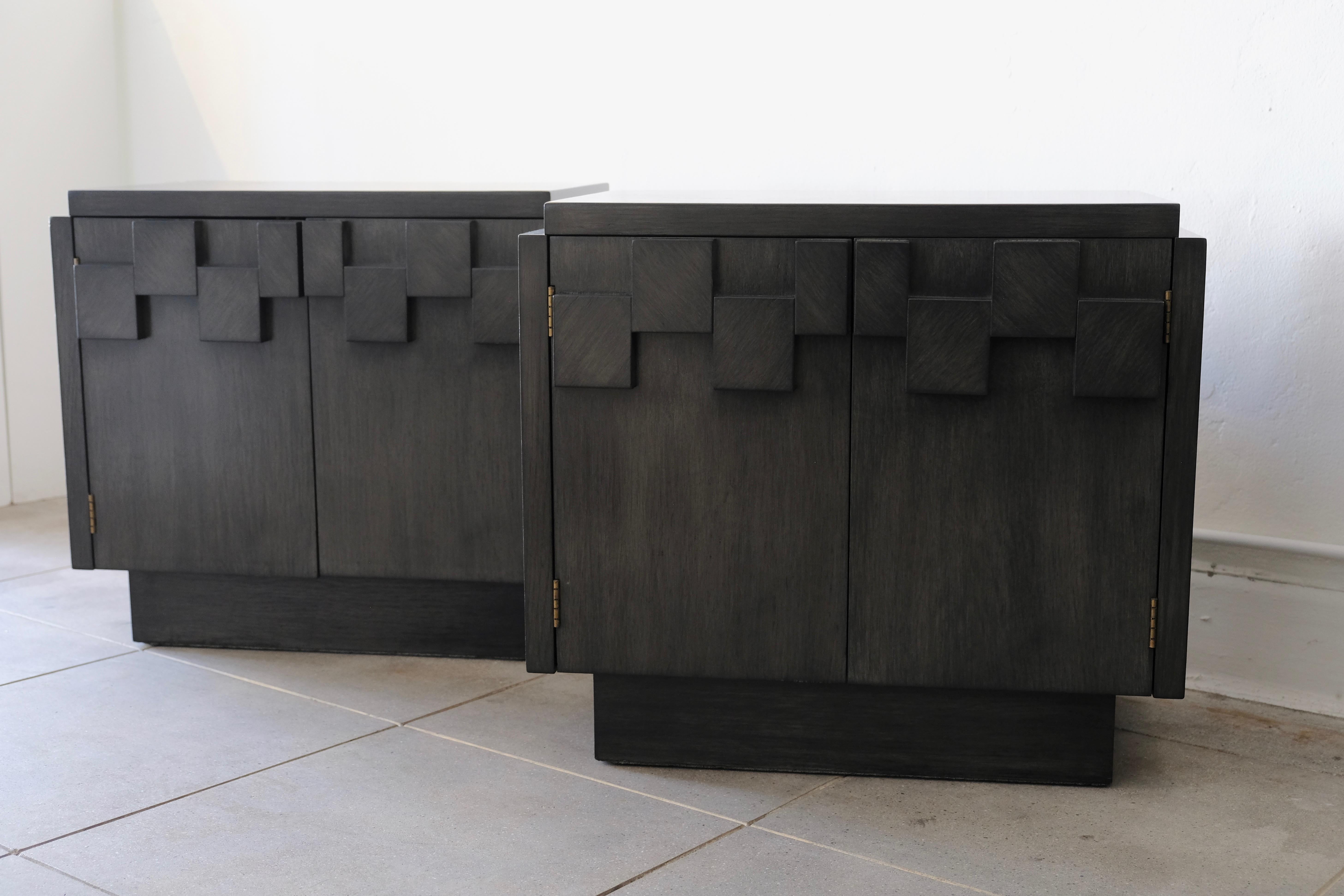 A pair of vintage Lane Brutalist nightstands with a raised geometric cubist pattern on the door fronts. The nightstands have been refinished in a deep charcoal gray stain with a dry brush finish on top to give the finish depth and dimension. The