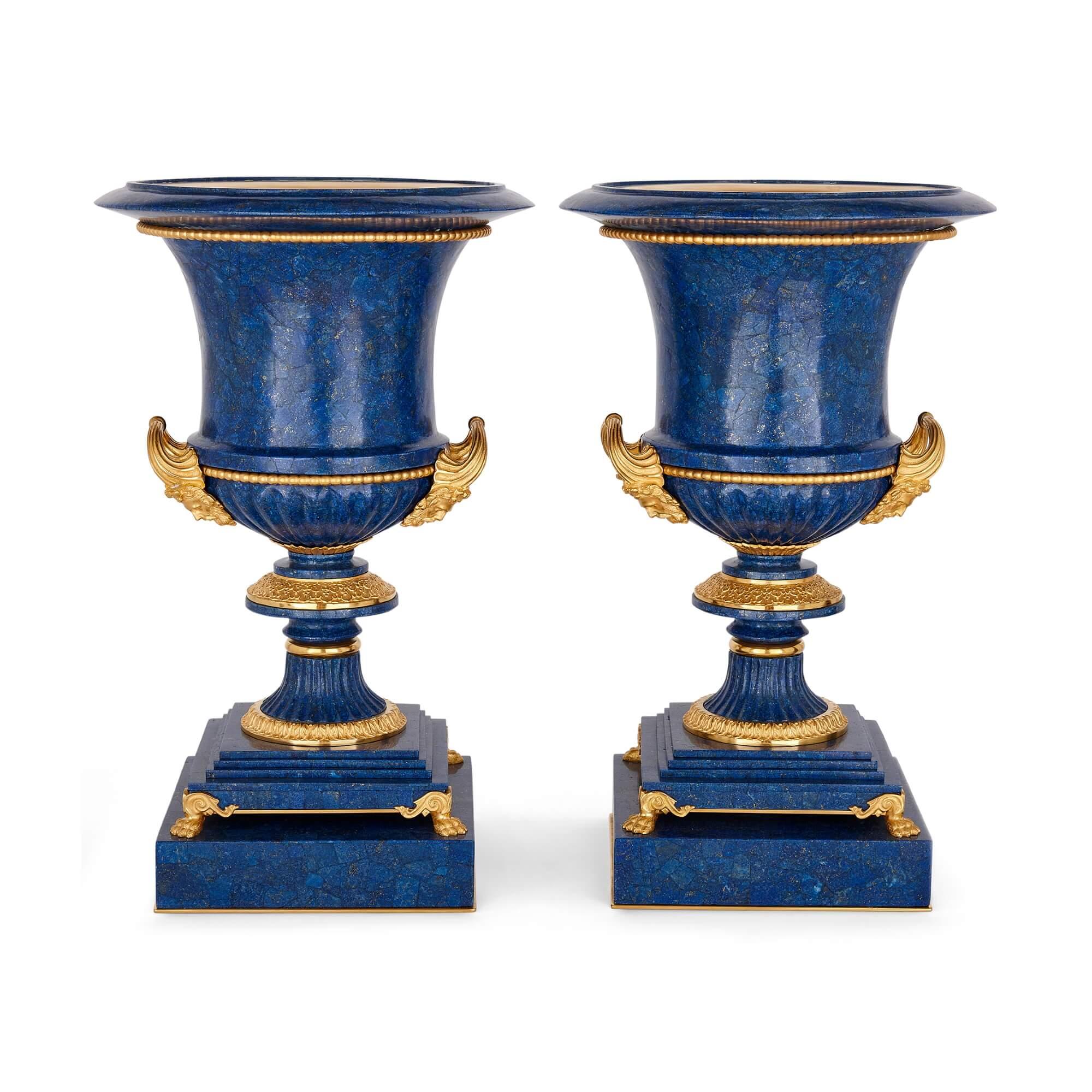 Pair of lapis lazuli and ormolu mounted 'Medici' vases after Galberg
French, 20th Century
Height 52cm, diameter 32.5cm

These stunning vases are made from lapis lazuli and ormolu: an exceptional and precious combination of materials, appropriate for