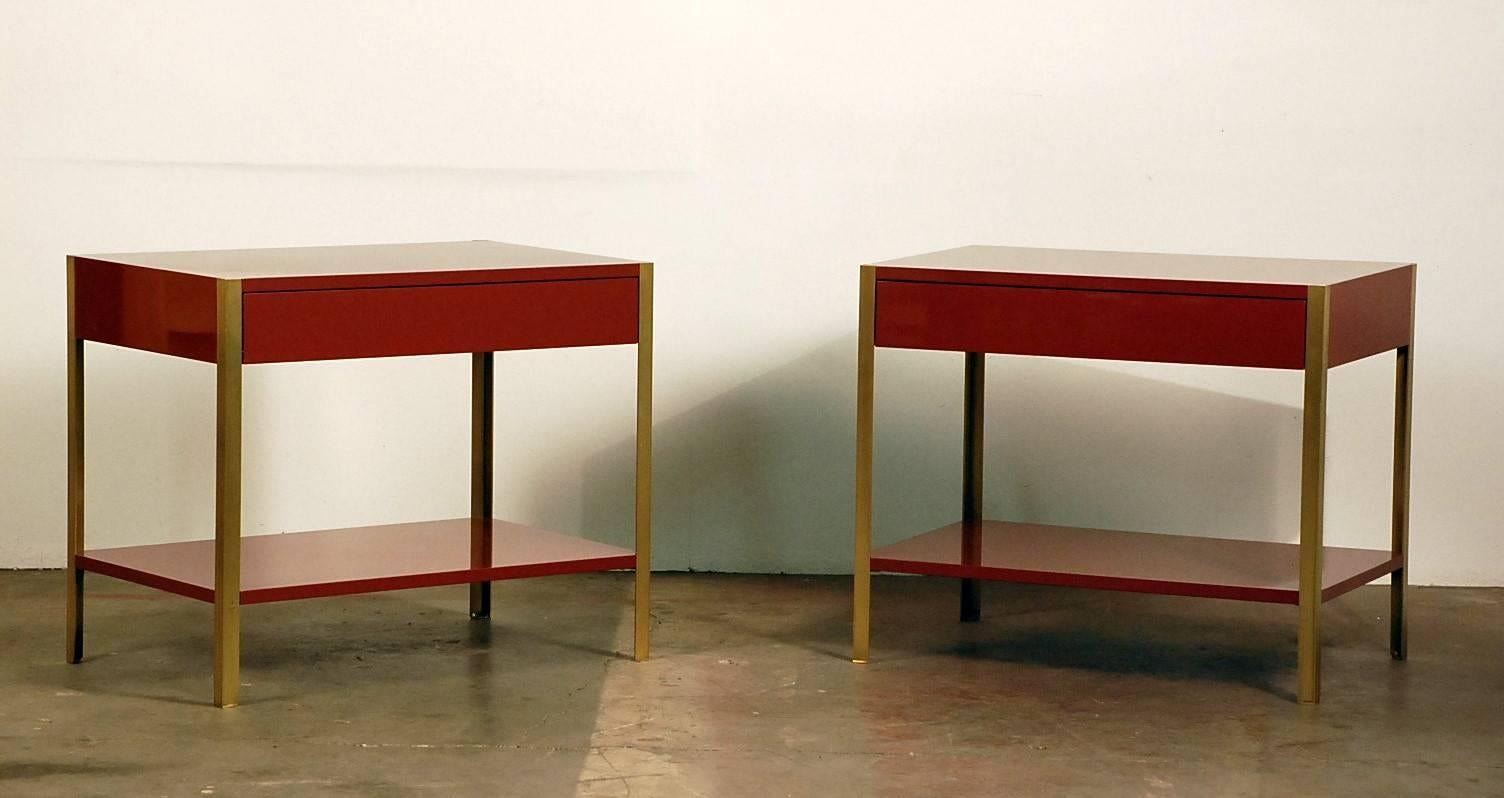 Pair of chic 'Laque' nightstands by Design Frères. Hand polished lacquer surfaces with brushed solid brass legs. Elegant and understated.