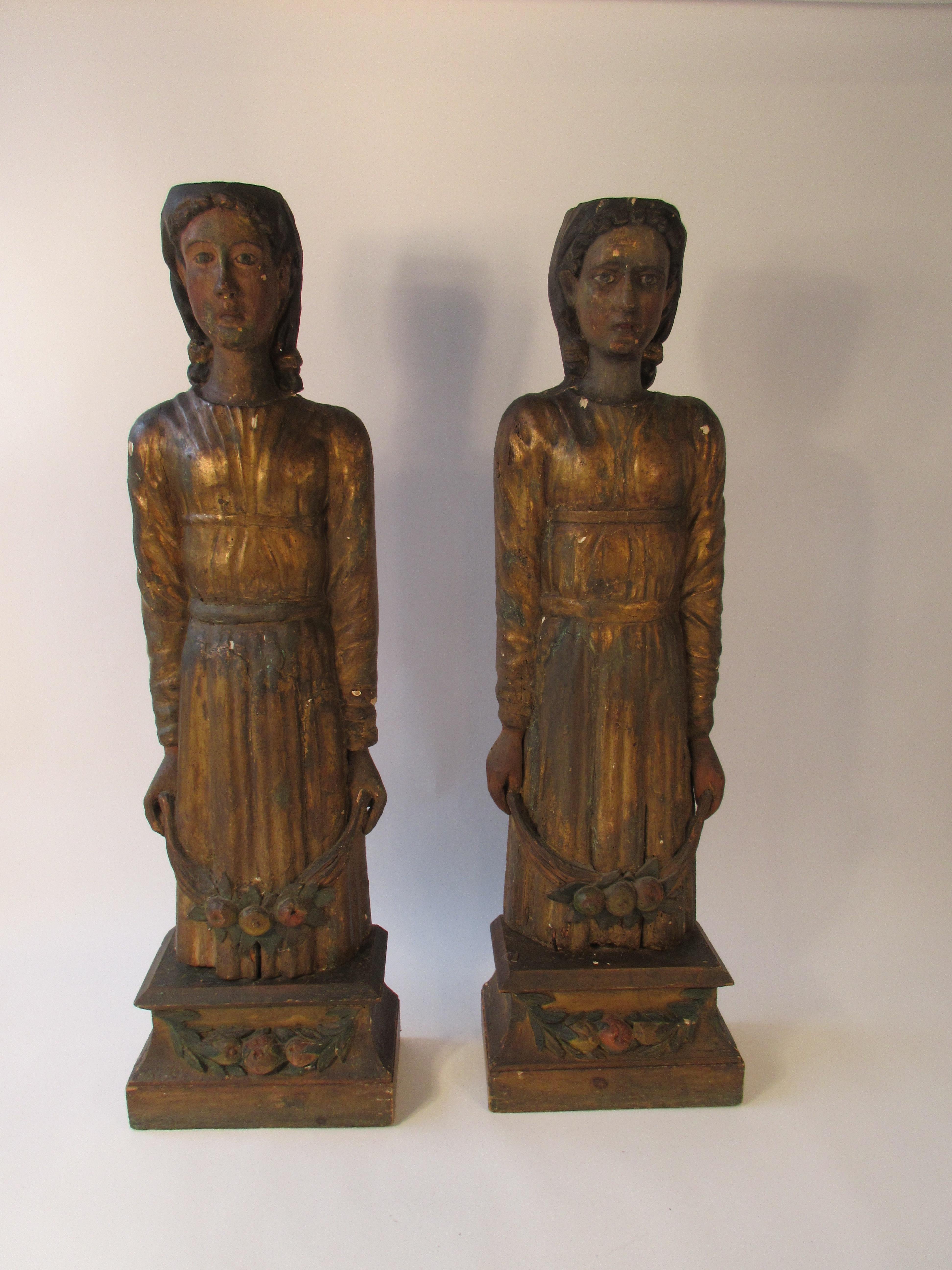 Hand carved wood Venetian figures off of the inside of a theatre in Venice from the 1840s. Gilded and painted.