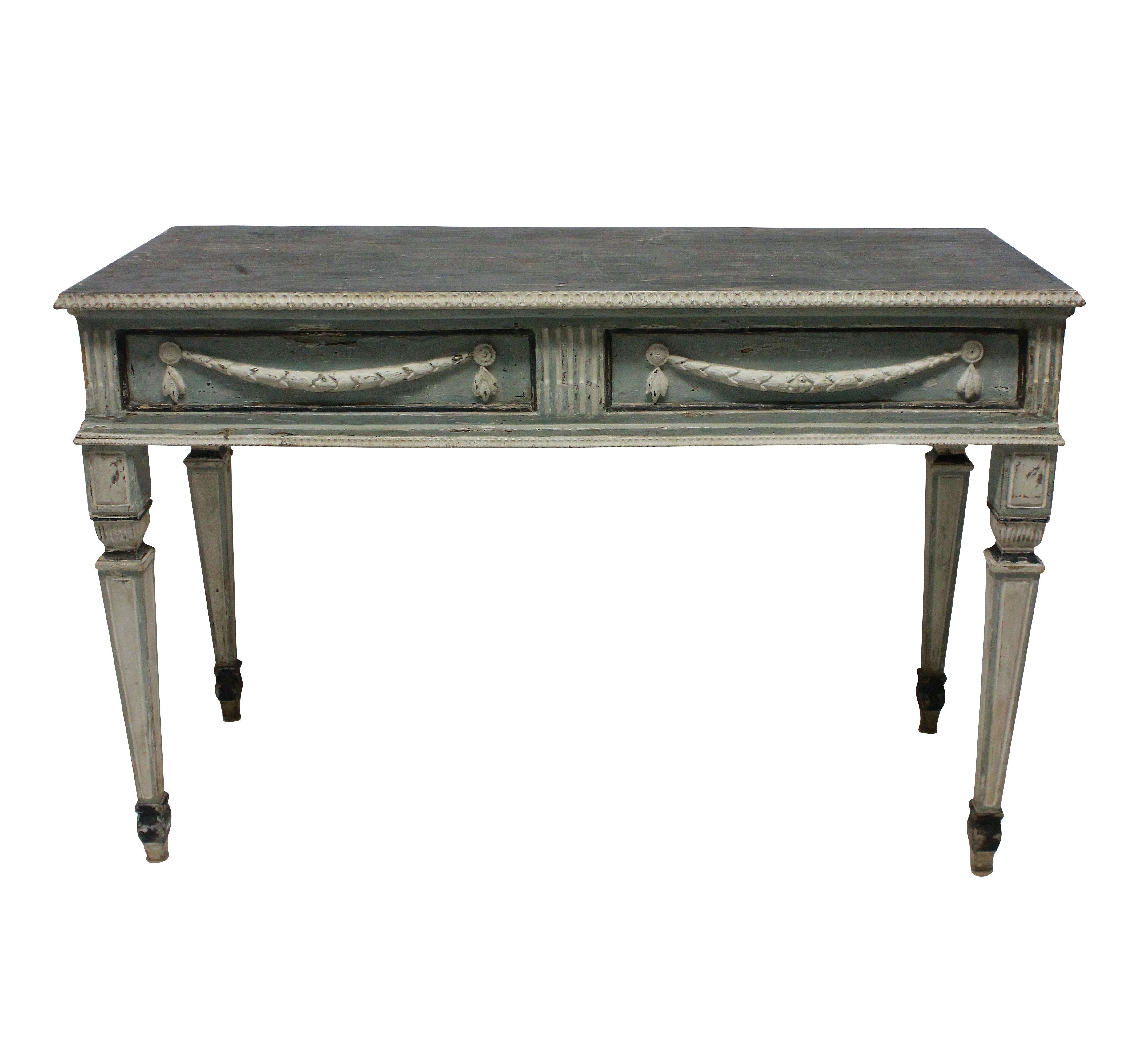 A pair of large scale Swedish 18th century console tables in the neoclassical taste. All of the paint is original and the colors are beautifully subtle in duck egg blues, soft white and charcoal.