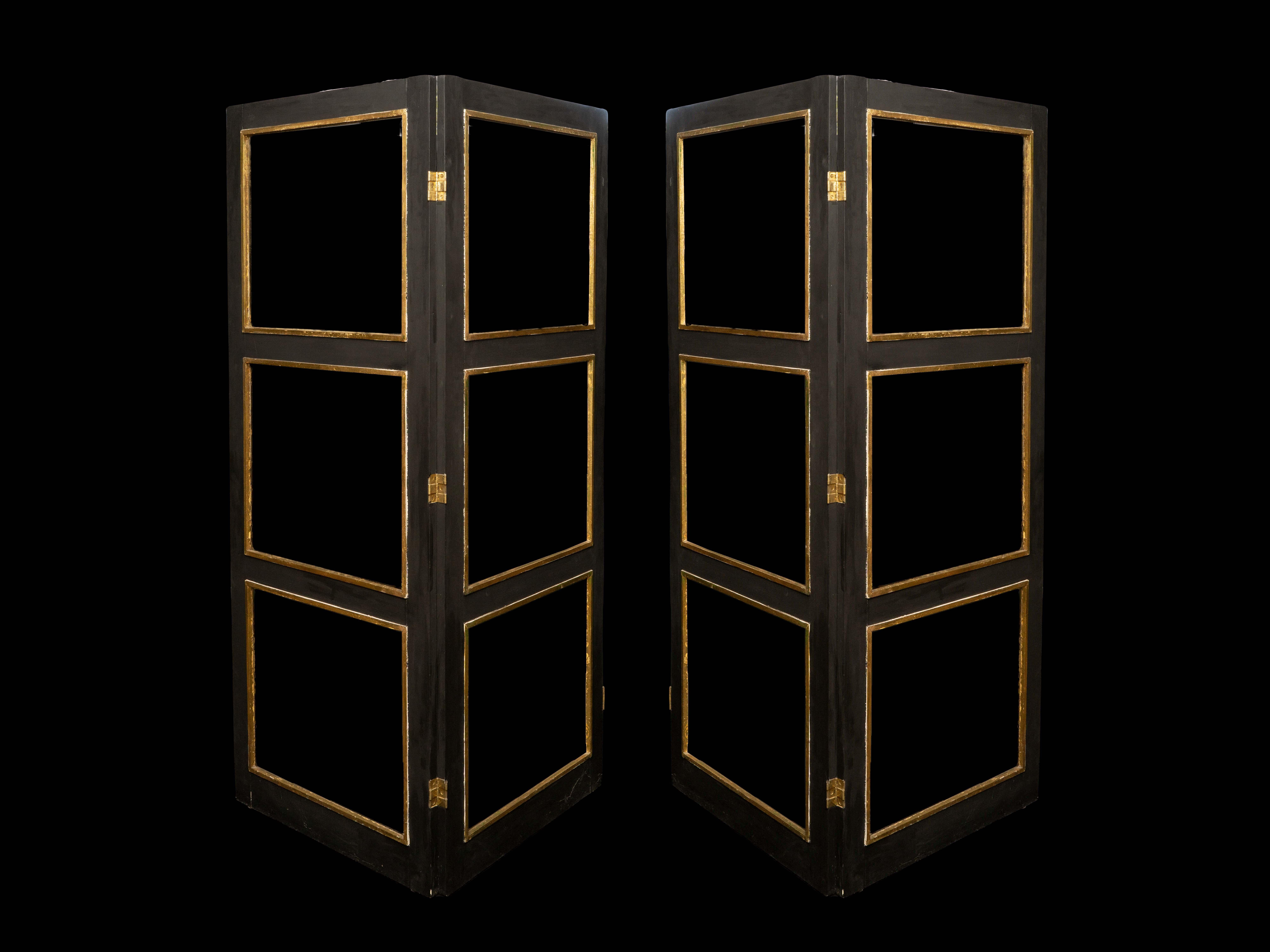 Pair of large 1940's French black and gilt room hinged screens or room dividers (Paravent) with beveled glass panels. The screens can be attached to create one larger screen. 

Measures: 27.5