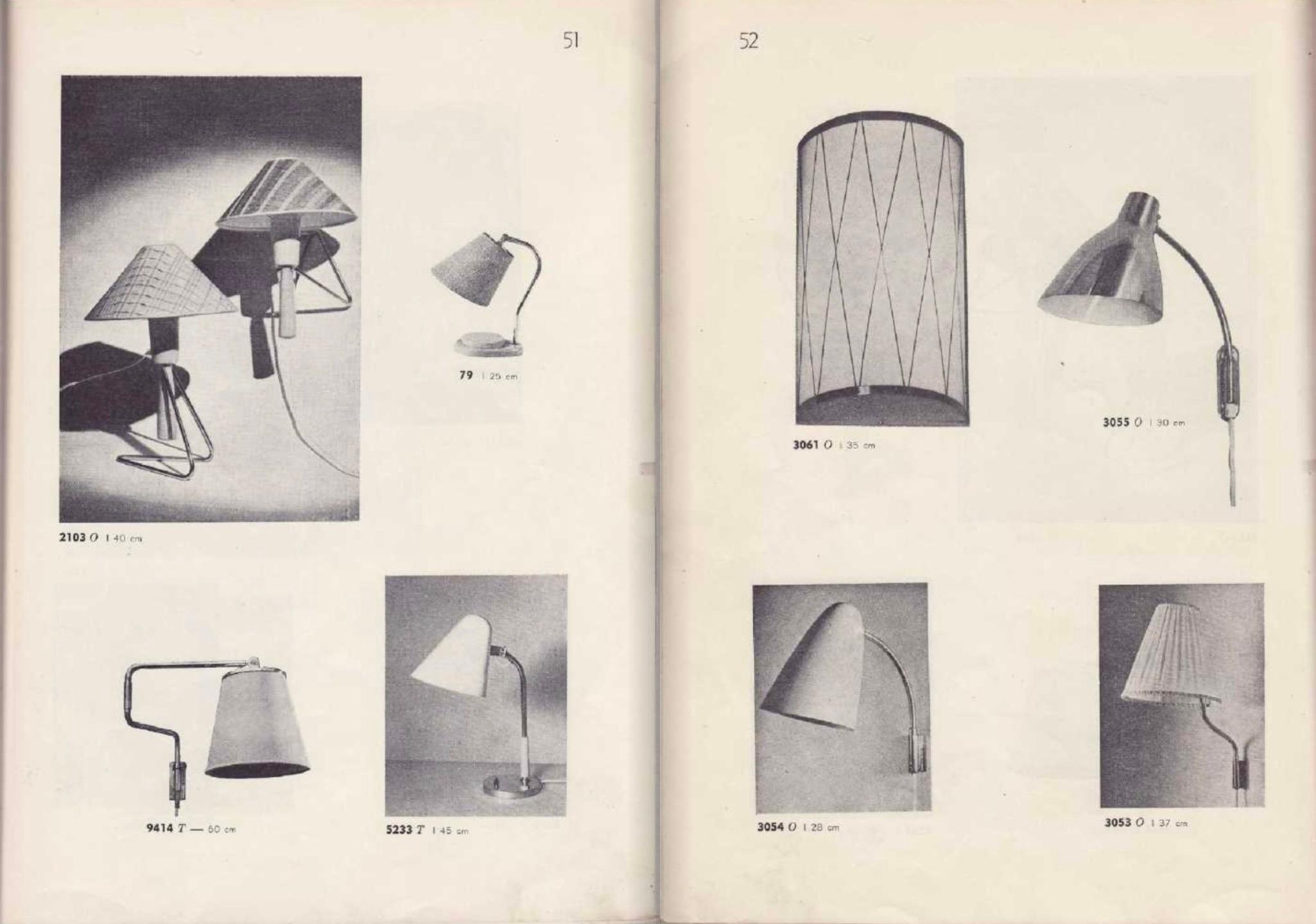 Pair of Large 1950s Lisa Johansson Pape #3055 Brass Wall Lamps for Stockmann. A highly sculptural pair of wall lamps executed in attractively patinated brass with white interior.

Price is for the pair. 

A contemporary of Paavo Tynell, the refined