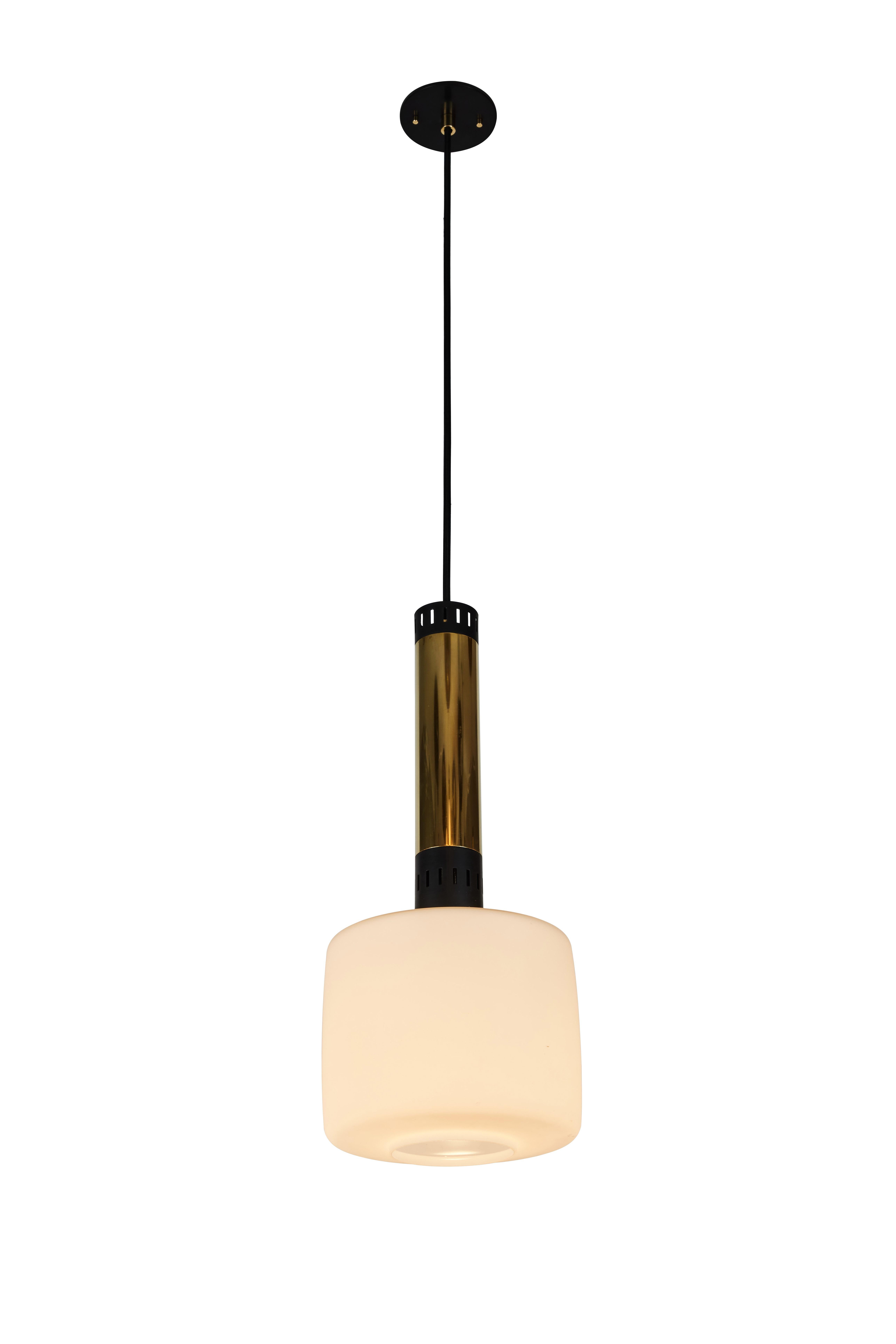 Pair of large 1950s Stilnovo glass and brass pendants. A quintessentially 1950s Italian design executed in matte finish opaline glass and polished brass with a custom fabricated architectural ceiling canopy for mounting over a standard American