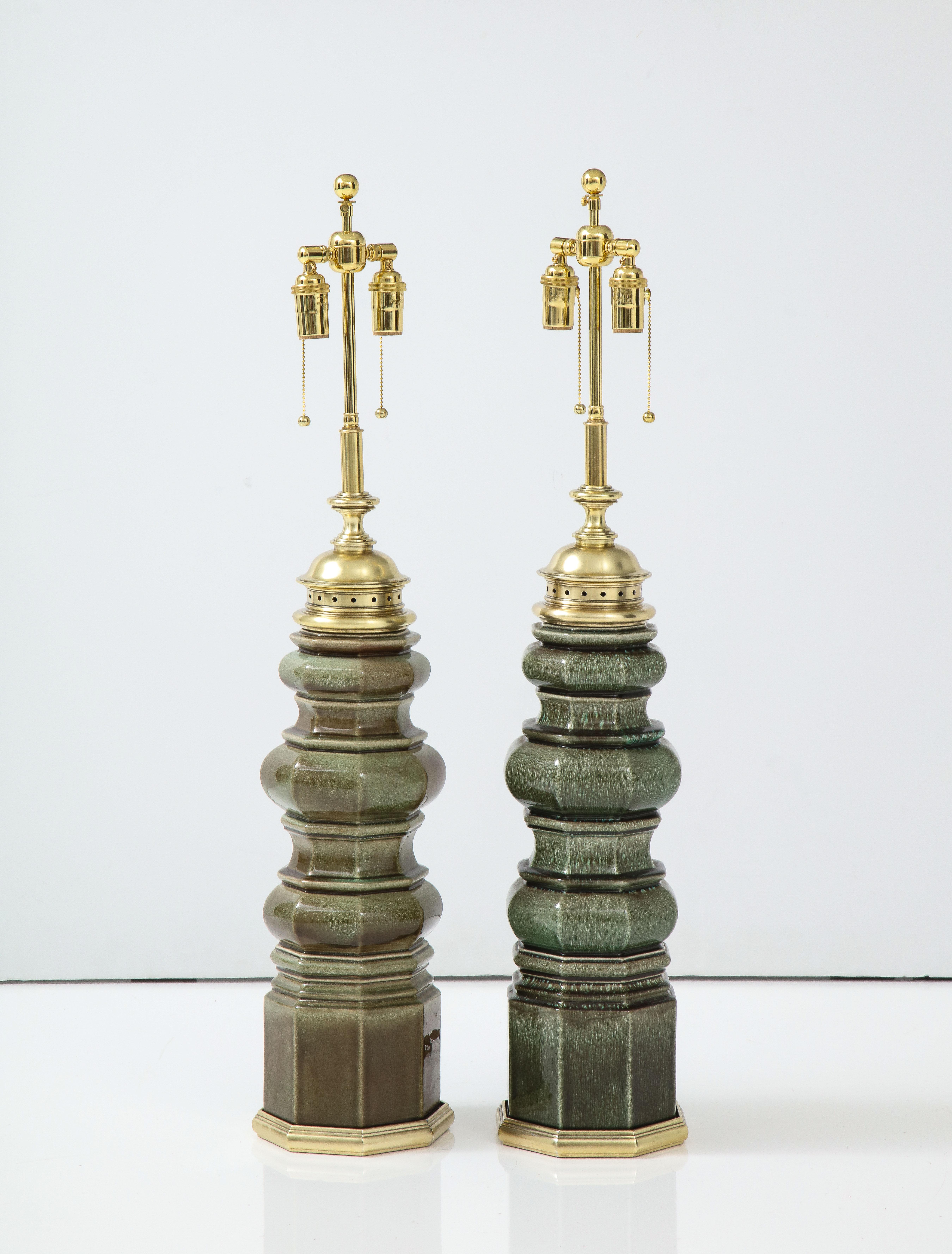 Wonderful pair of Large Pagoda lamps by Stiffel lamp company.
The Pagoda shaped ceramic lamps have a lovely Moss Green glazed finish and they have been Newly rewired with adjustable polished brass double clusters and silk rayon cords.
They are