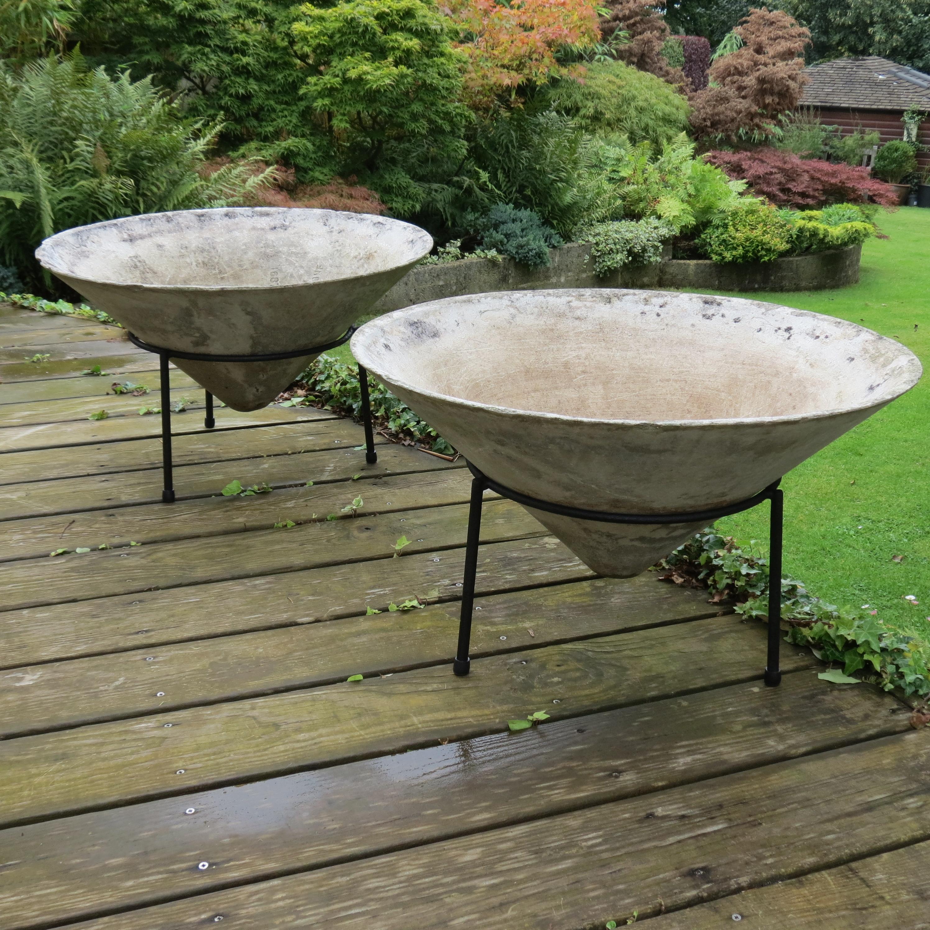 Pair of large conical planters from the 1960s by Florastone. Designed in a style reminiscent of works by Willy Guhl. Made from fibrous concrete. On original metal stands. Good vintage condition with wonderful patination.


ST1619