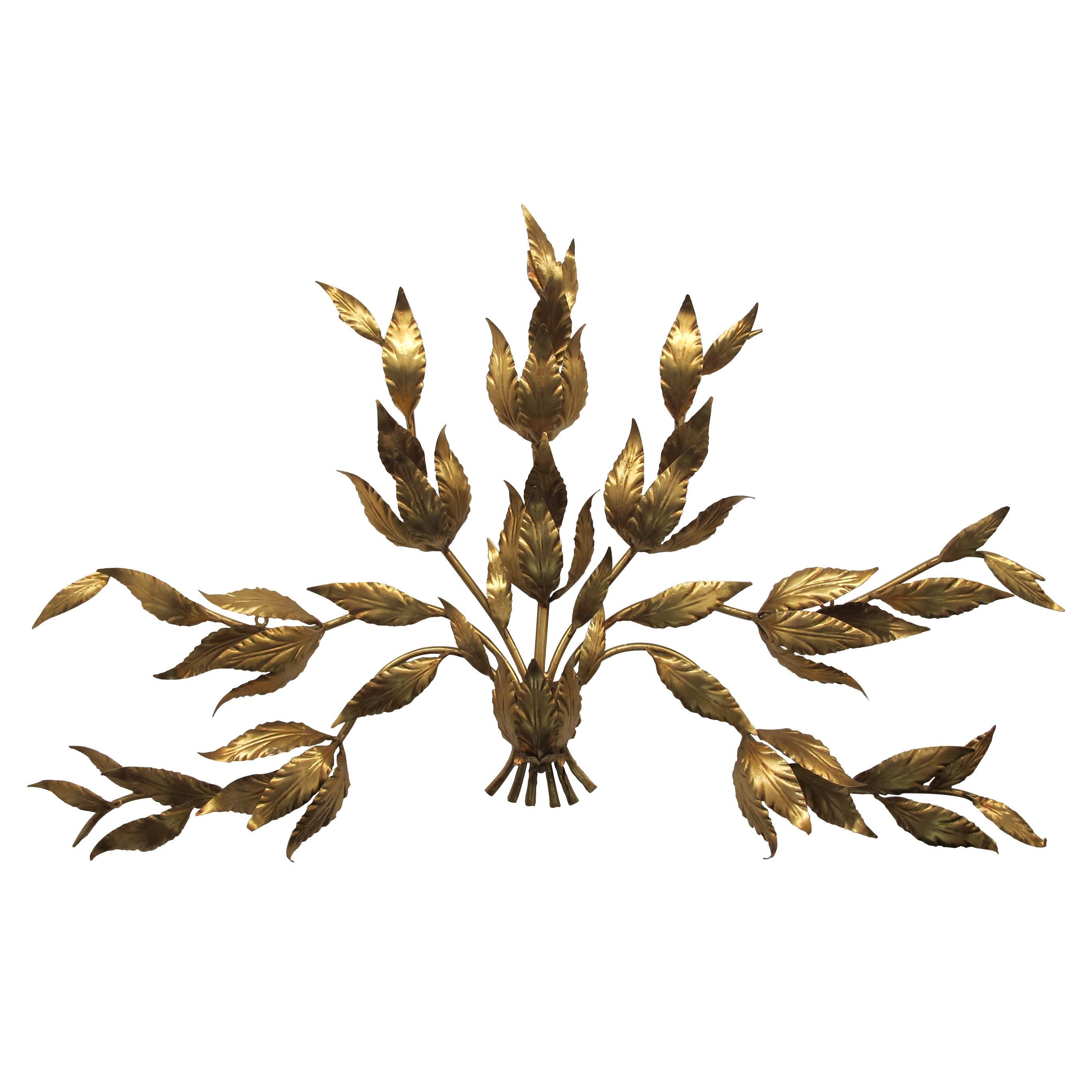 A very large and highly decorative pair of 1960s wall lights by Hans Kögl, model “bouquet”. The gilt metal is in excellent condition. Each wall light boasts 9 light bulbs evenly and discretely hidden in the seven foliage branches which cast a warm